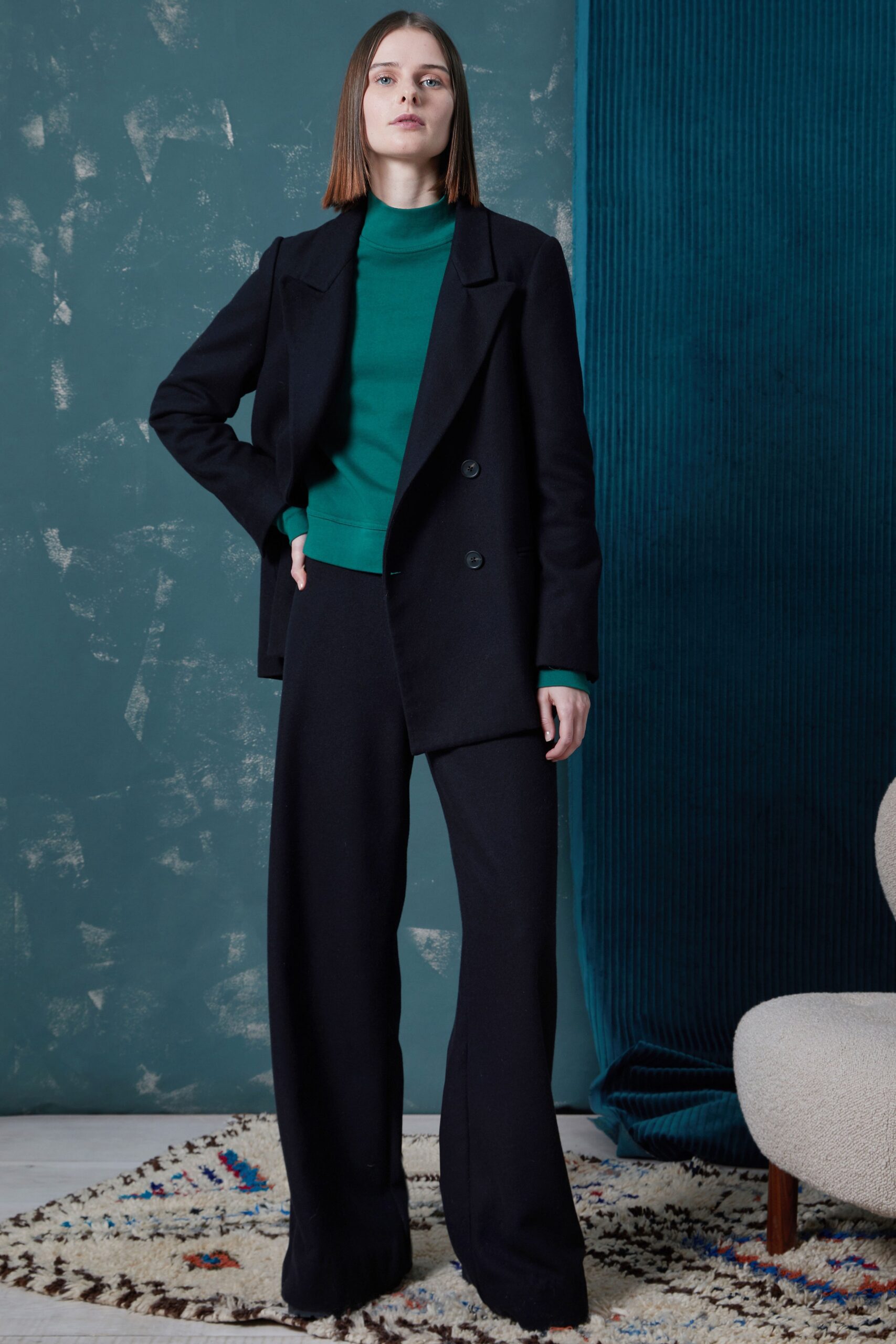 black tailored blazer with green top
