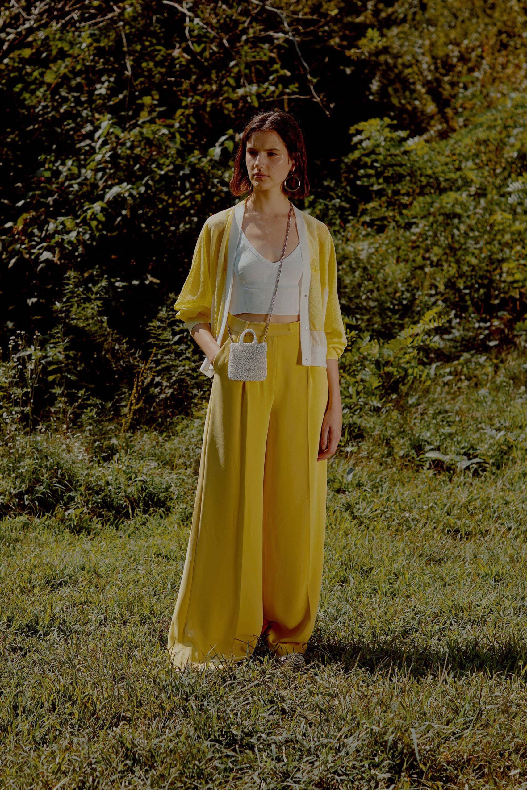 yellow jacket with white top and wide-leg pants
