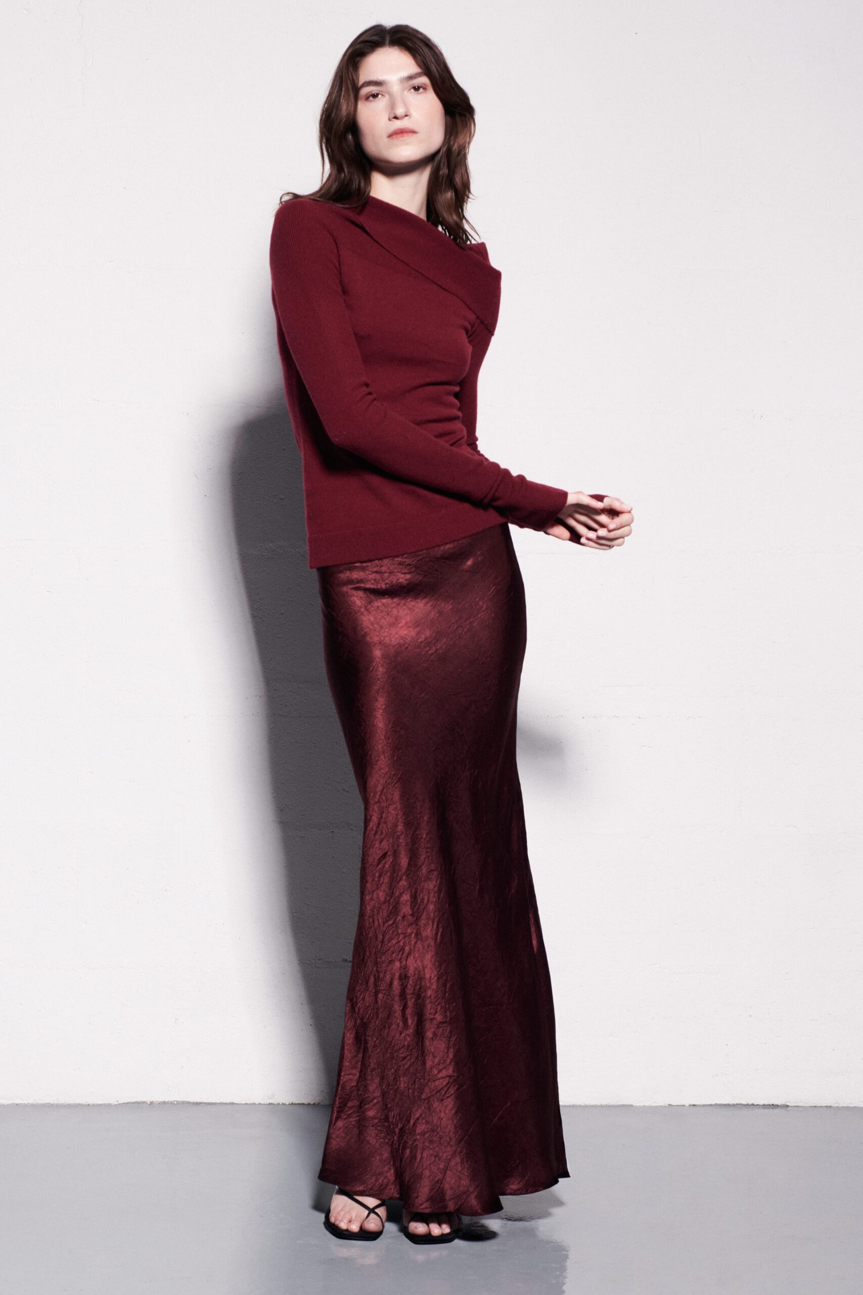 red fitted top with maroon skirt