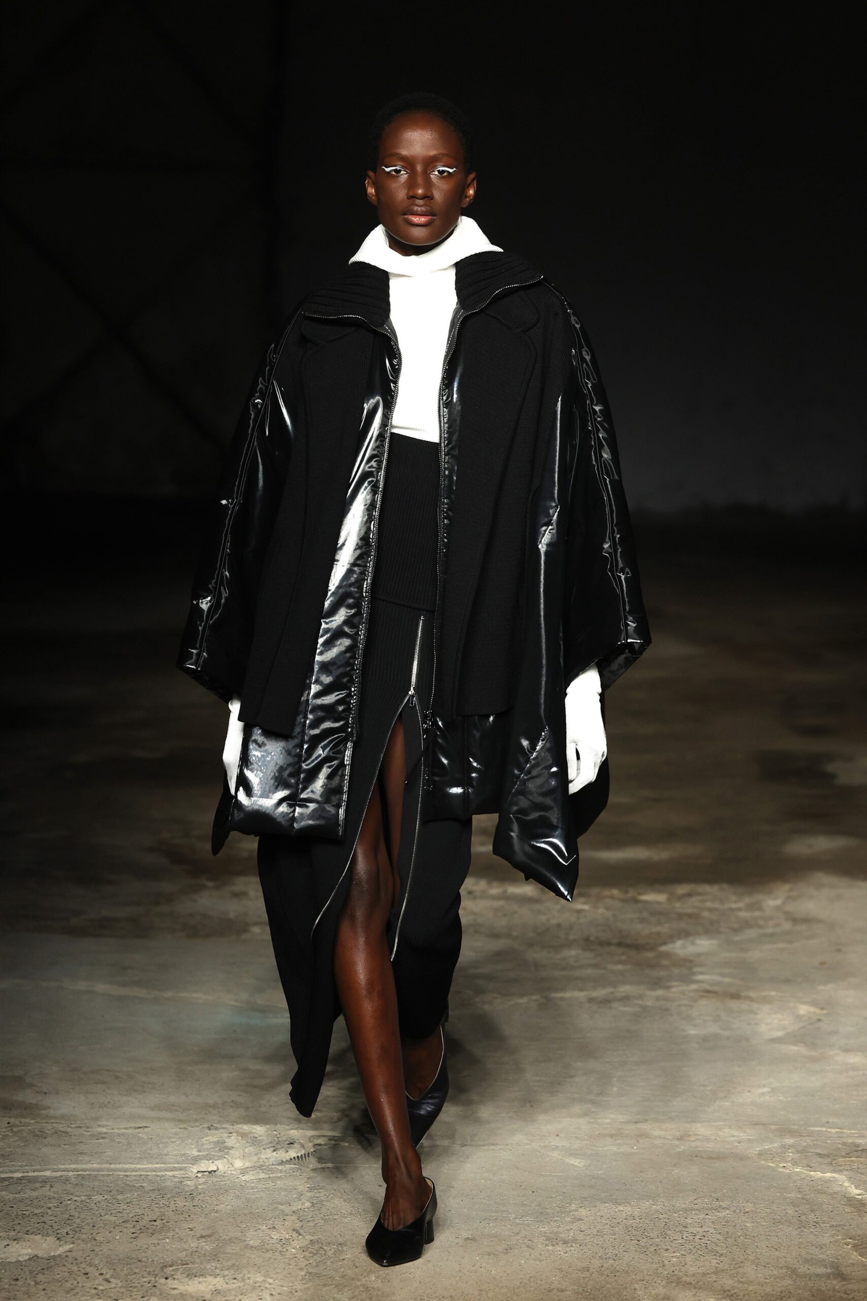 black wool coat white top black skirt