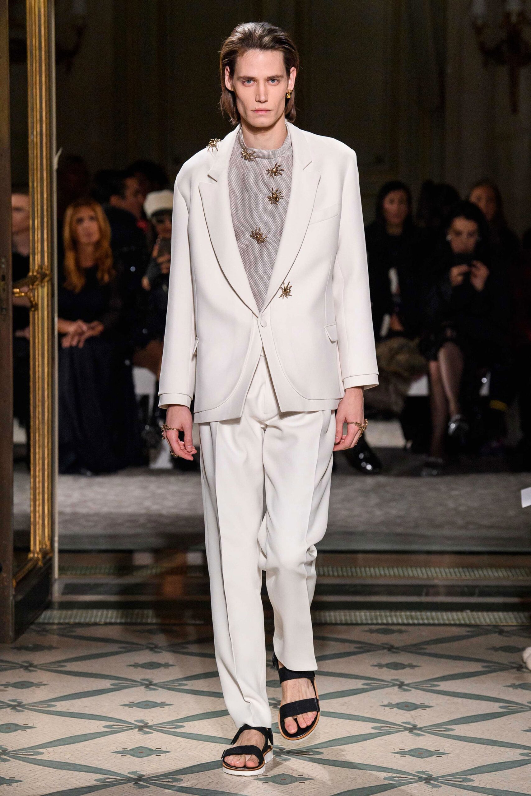 white tailored suit with black shoes