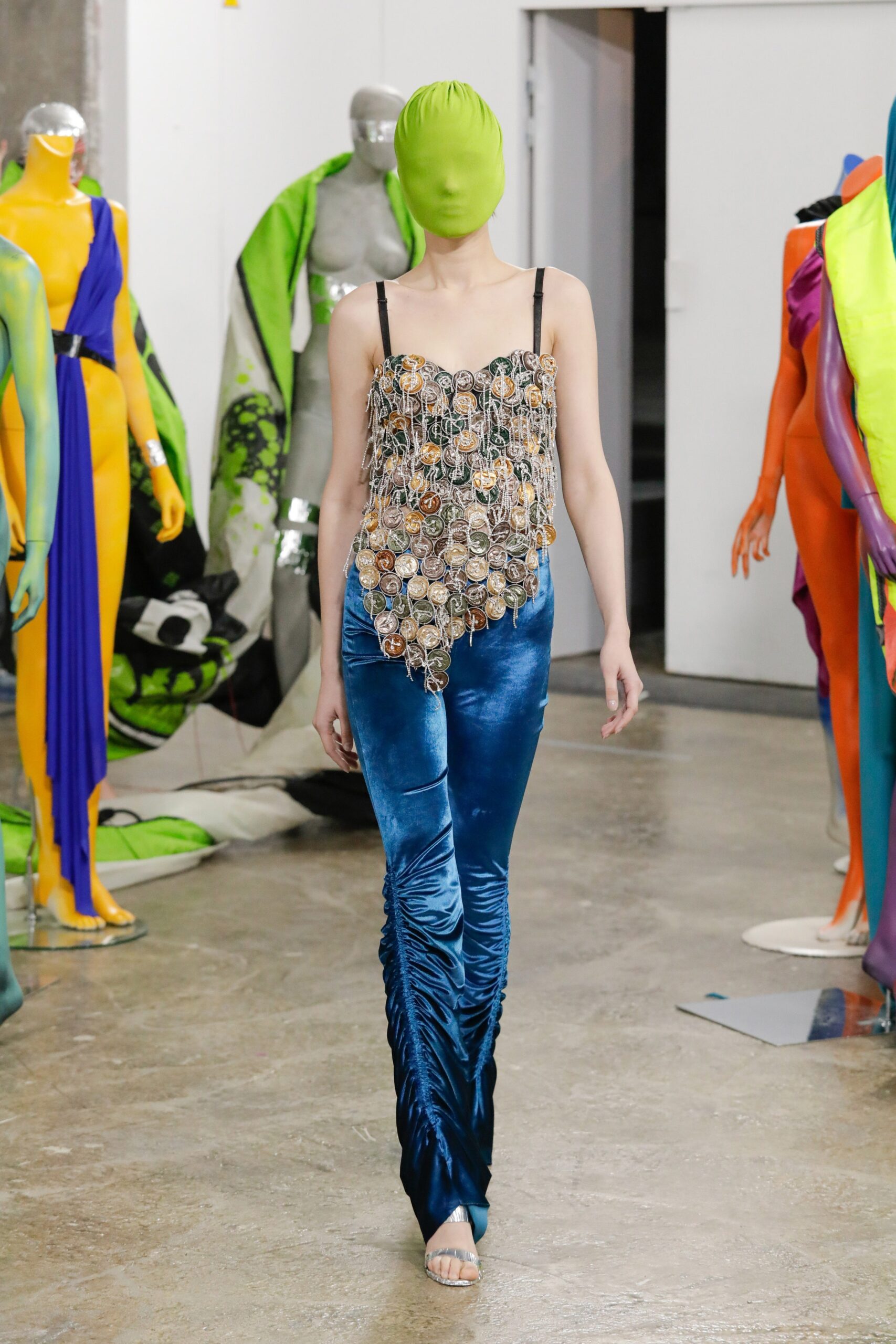 multi-colored beaded top with blue pants