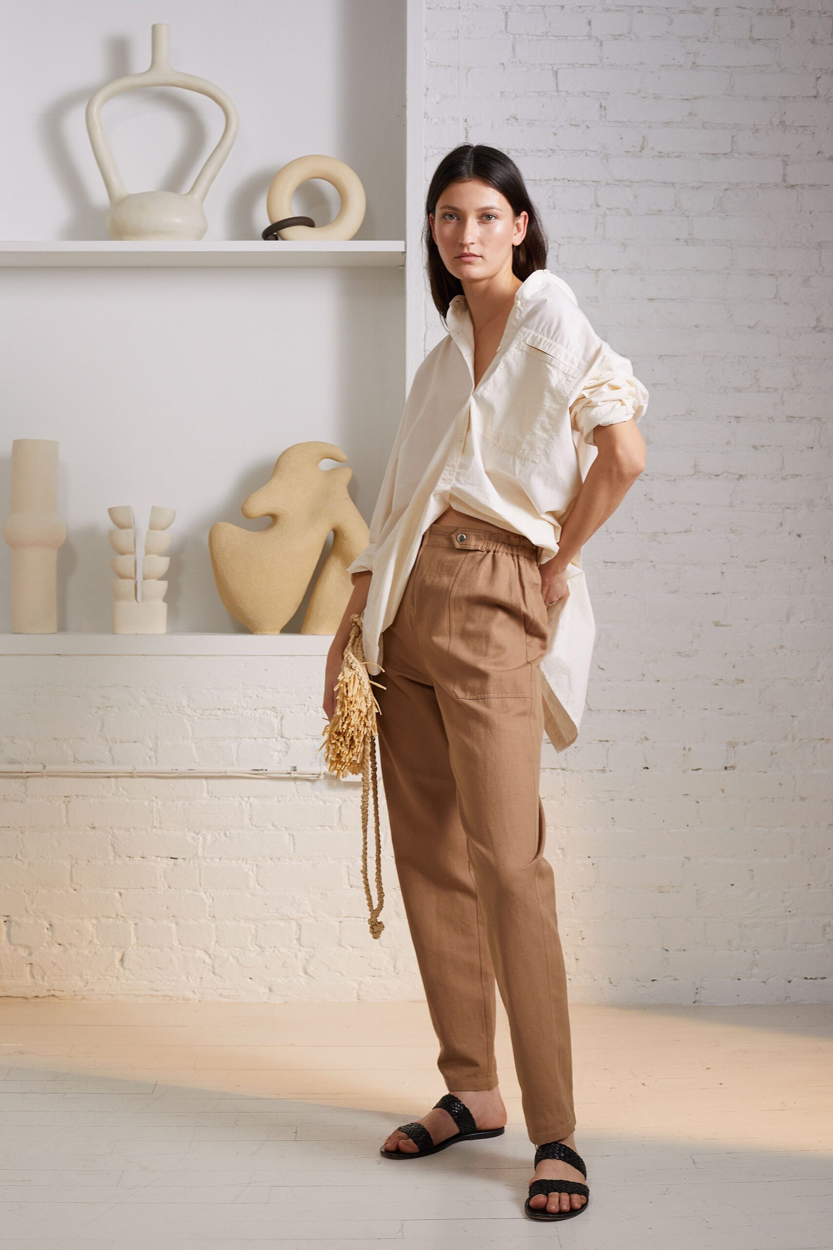 white relaxed shirt with brown pants