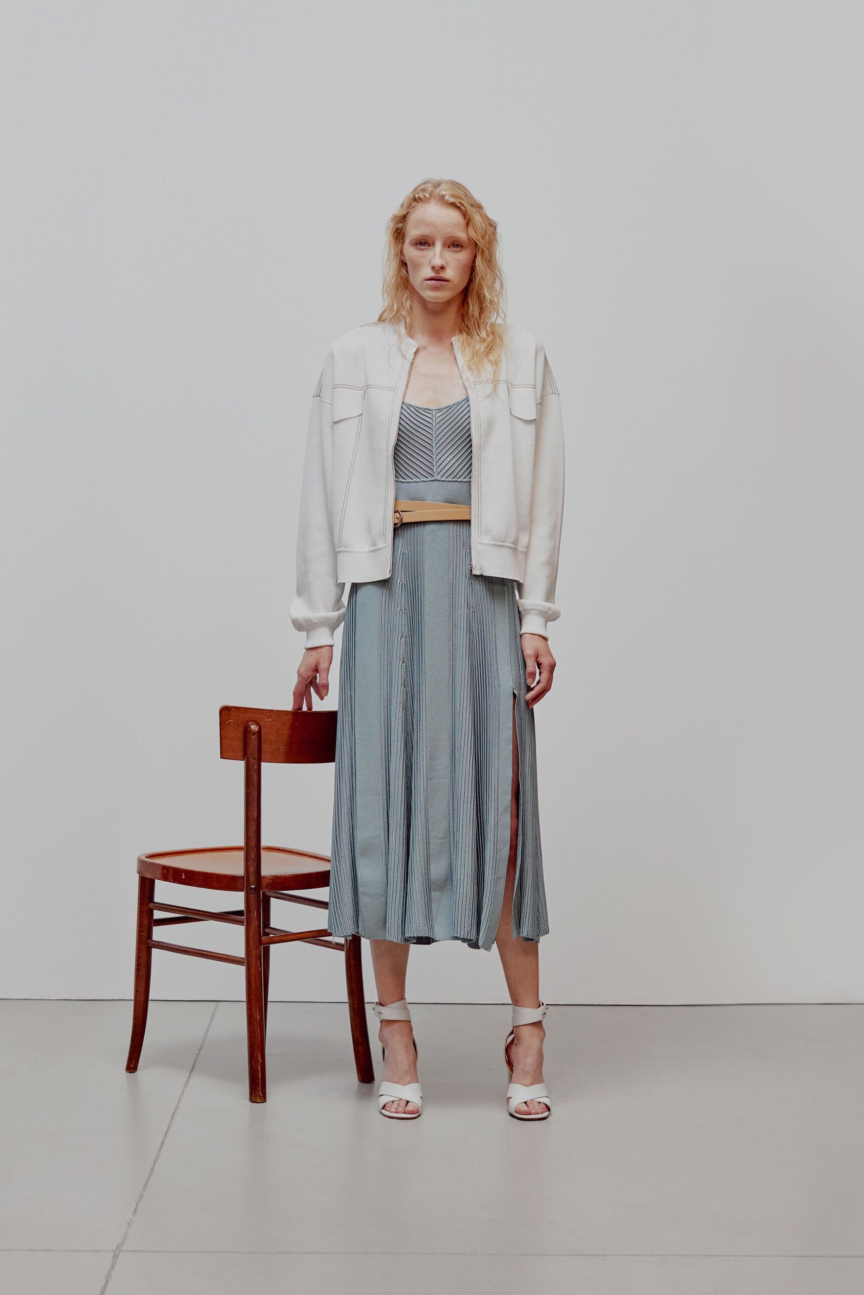 white relaxed jacket blue pleated dress
