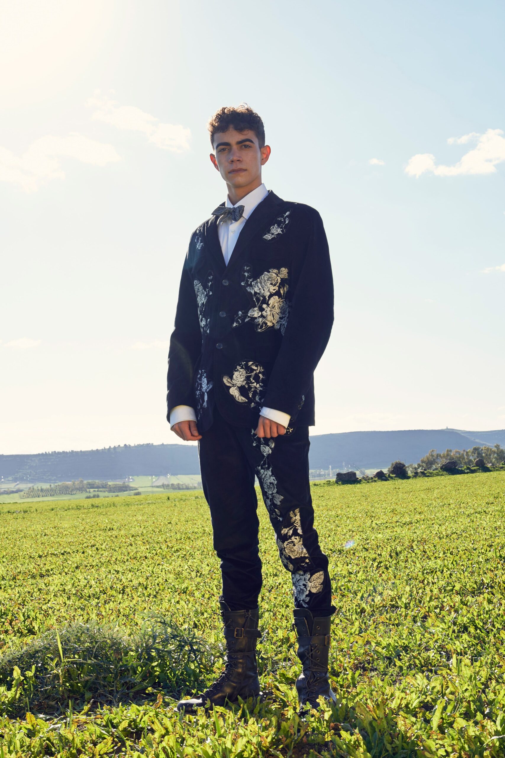 black embroidered suit with brown shoes