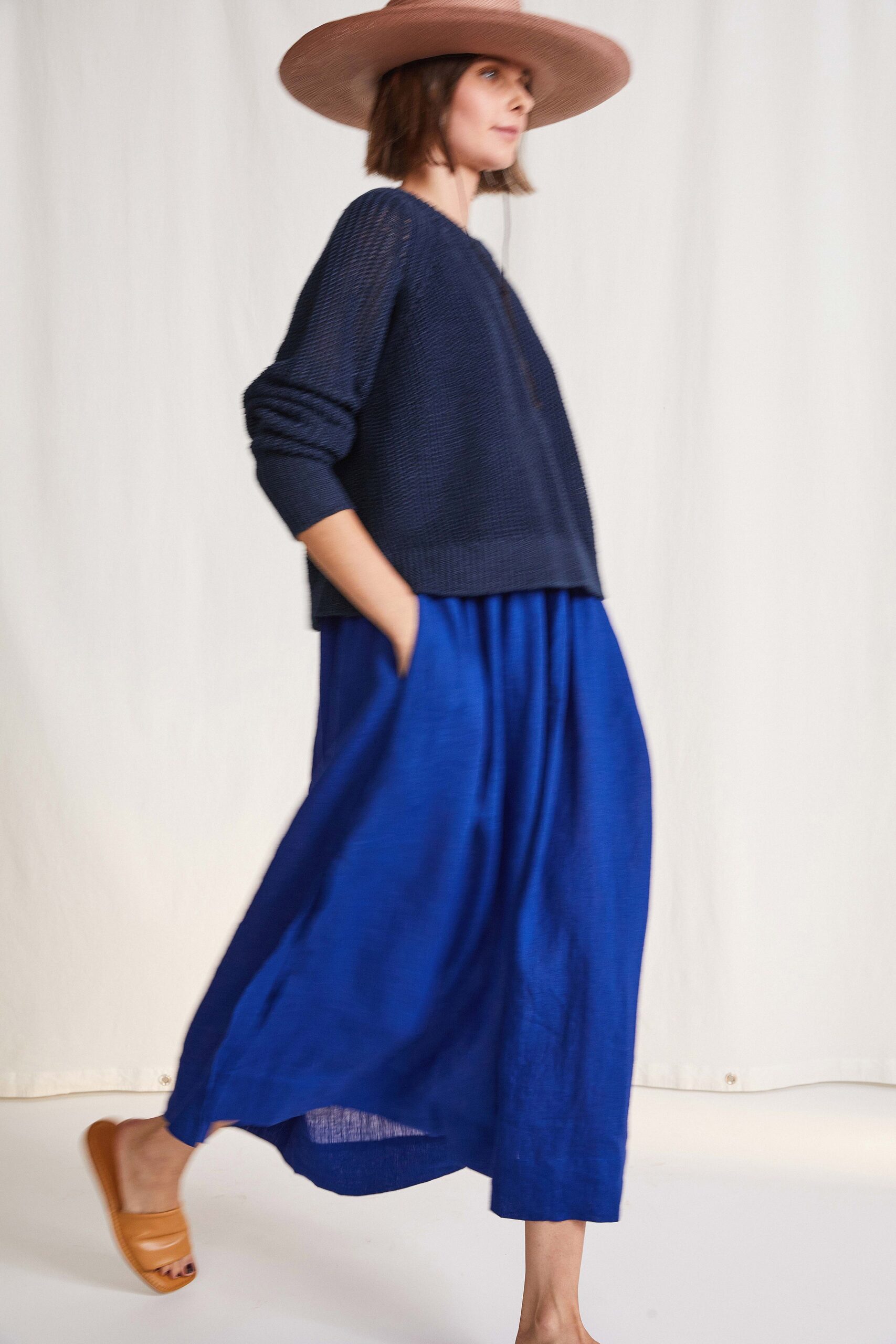 navy sweater and blue skirt
