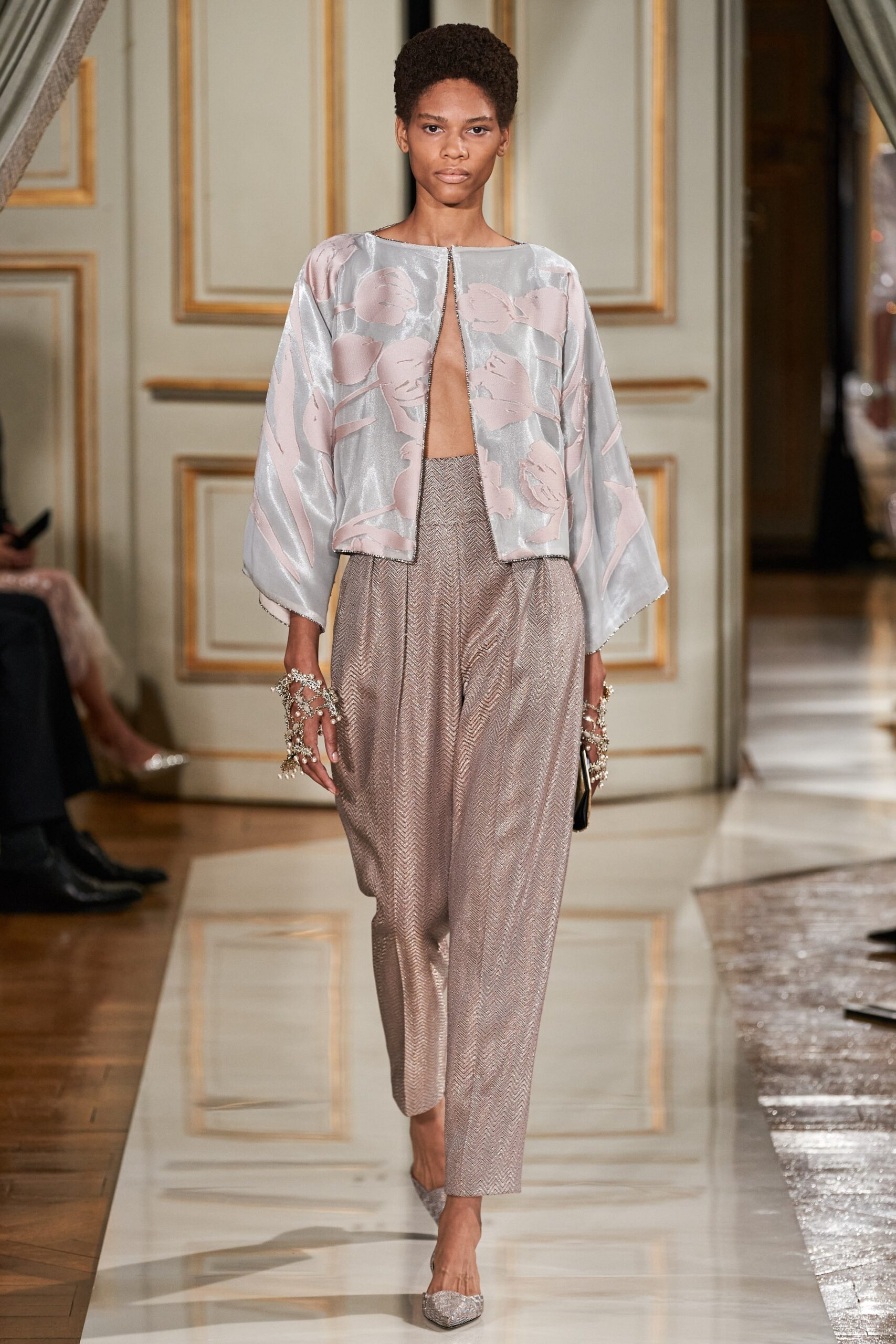 pink silk jacket with beige pants