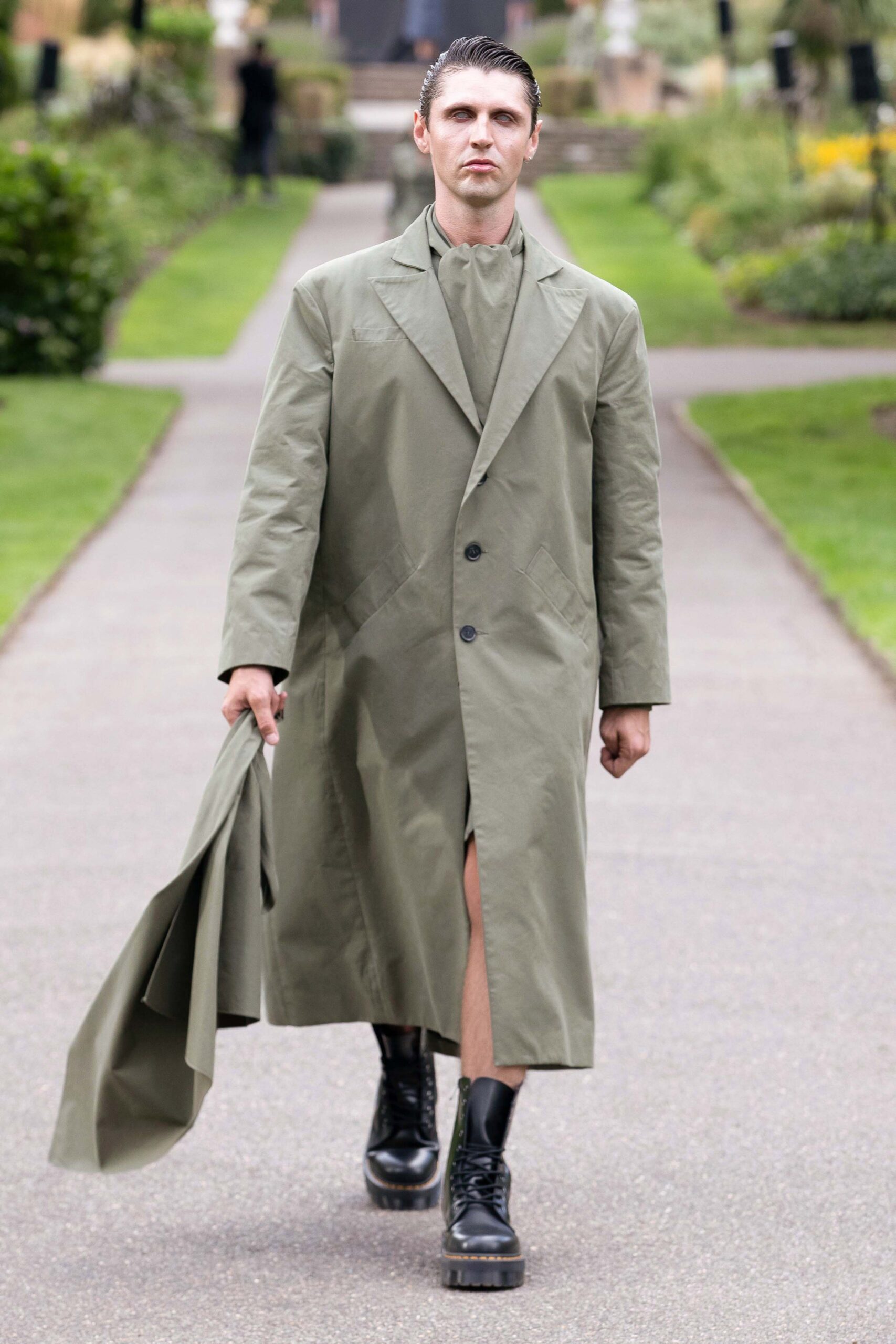 green cotton coat with black boots