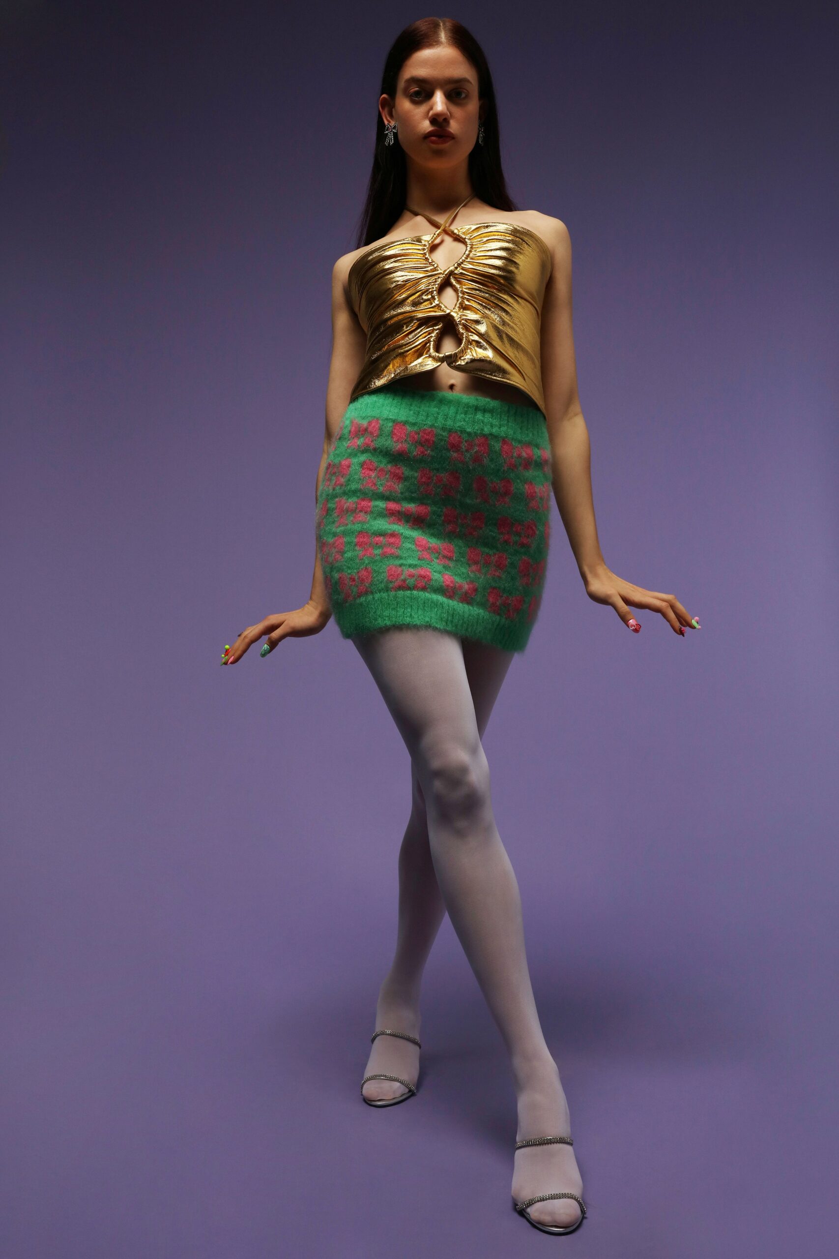 gold metallic sleeveless top and mini skirt