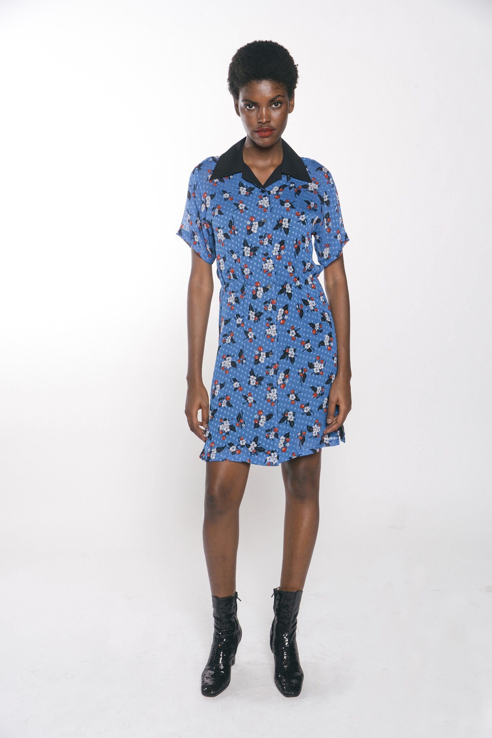 blue floral short-sleeve dress with black boots