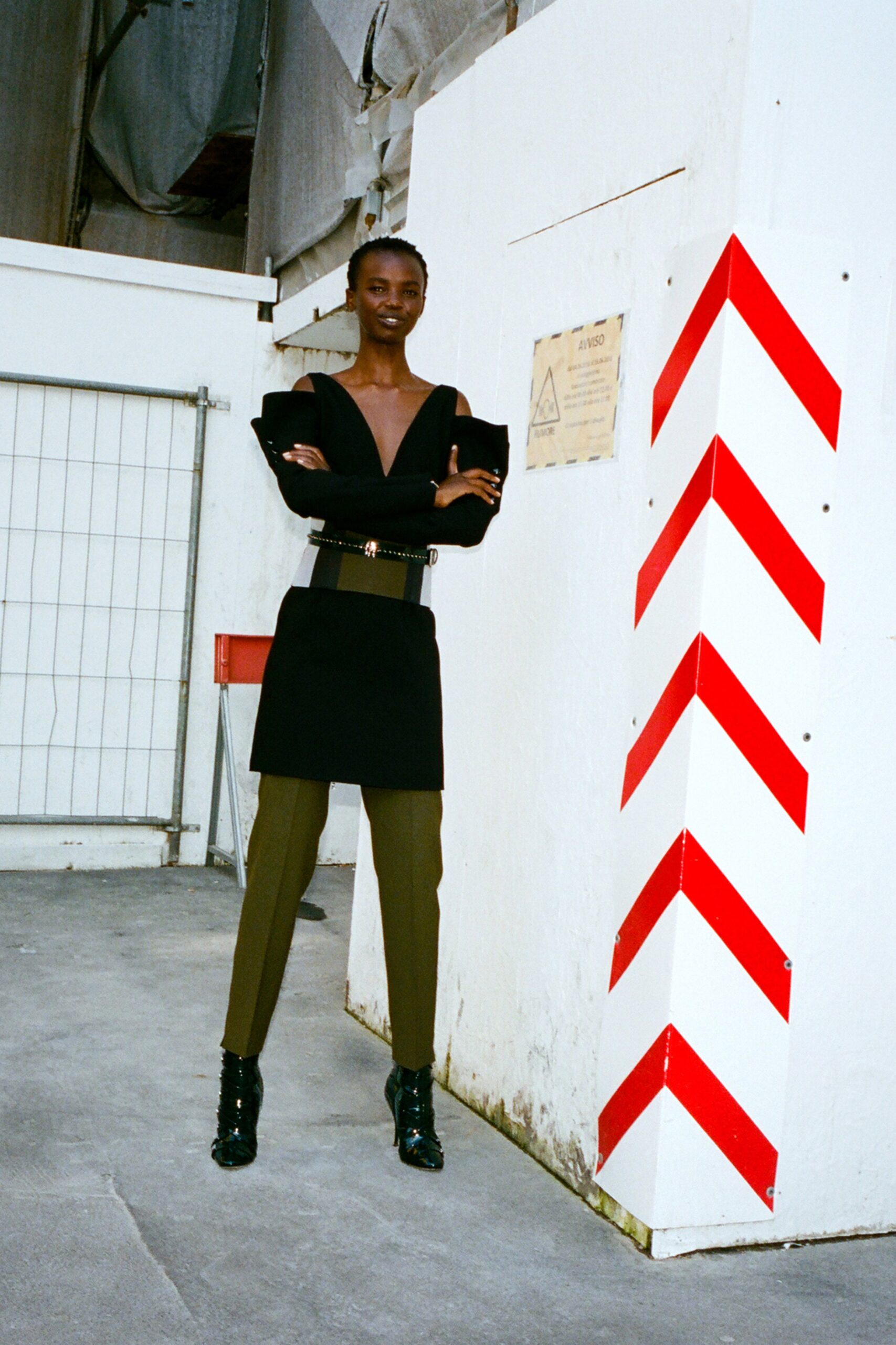 black fitted top with olive pants