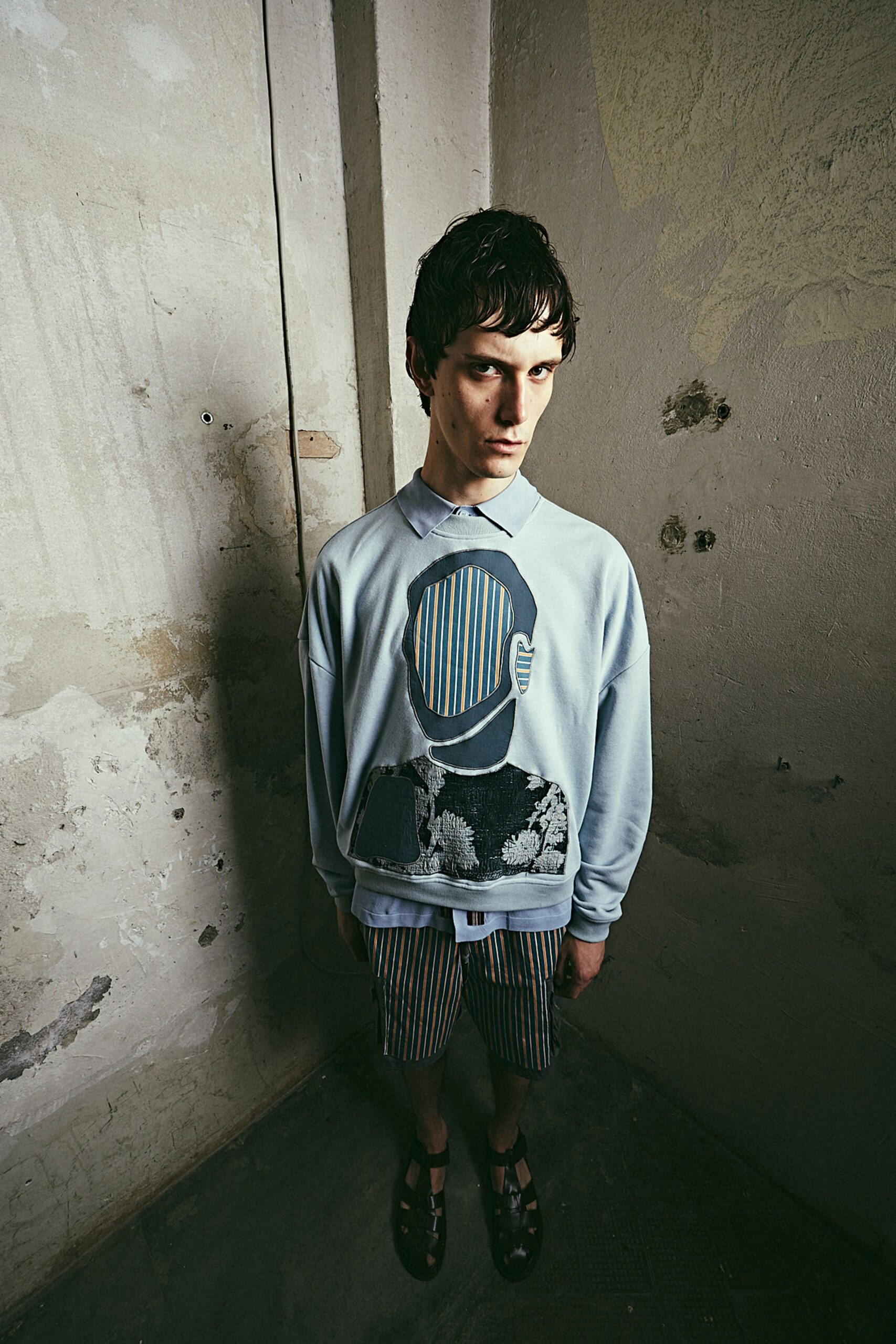 blue printed sweater and striped shorts