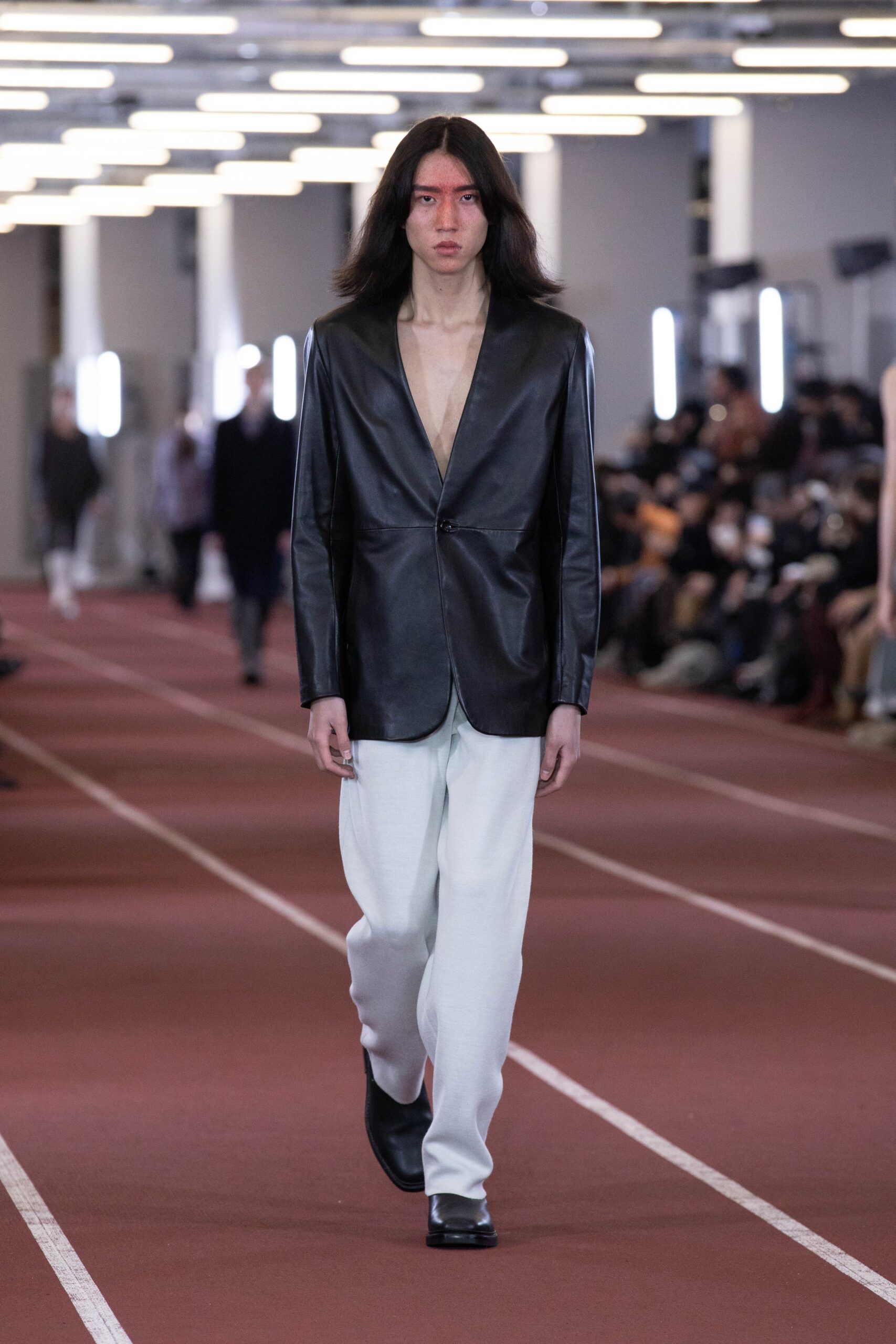 black leather tailored blazer and white relaxed pants