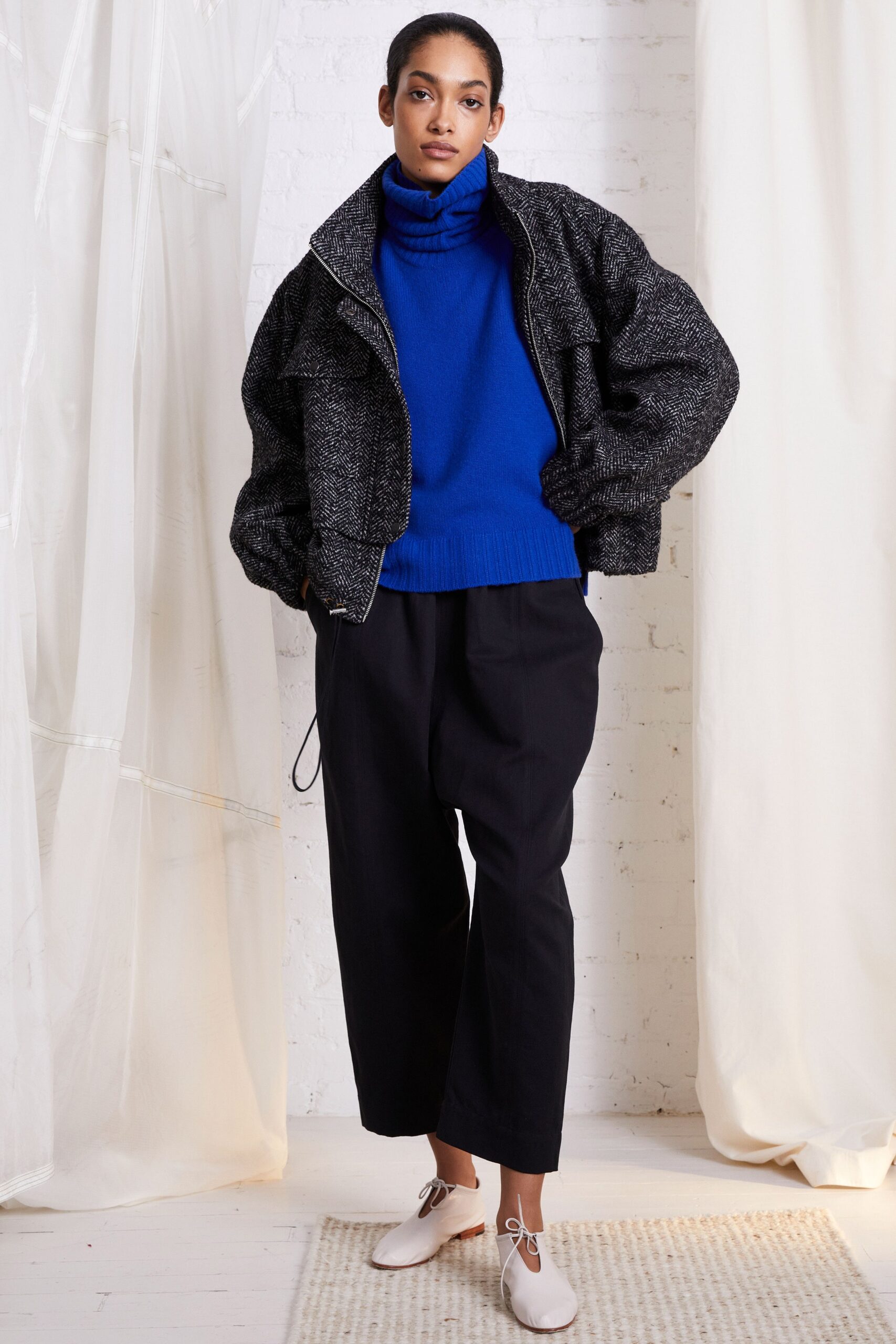 relaxed black and white jacket with blue sweater