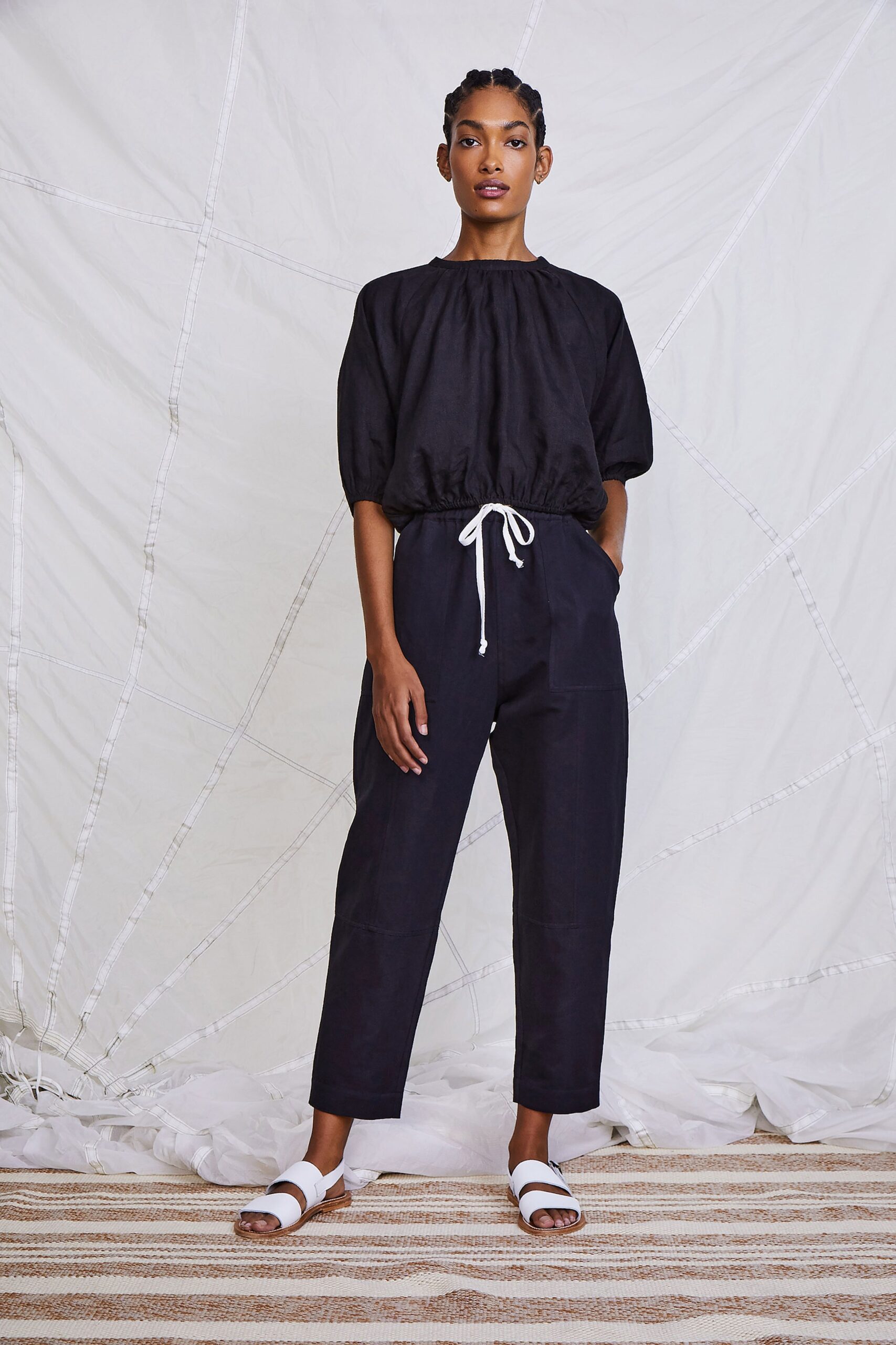 black relaxed top with tailored pants