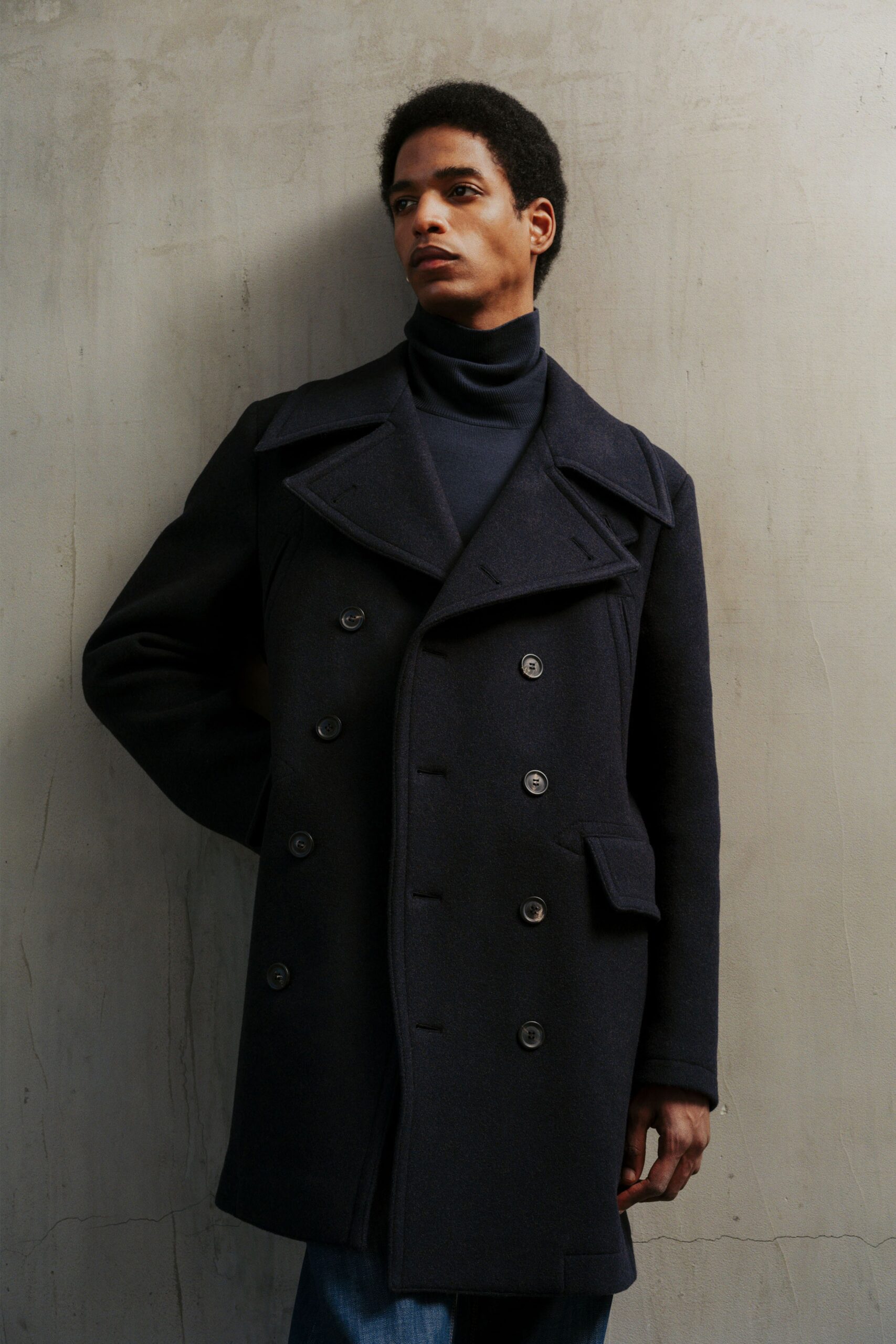 black wool coat with blue turtleneck
