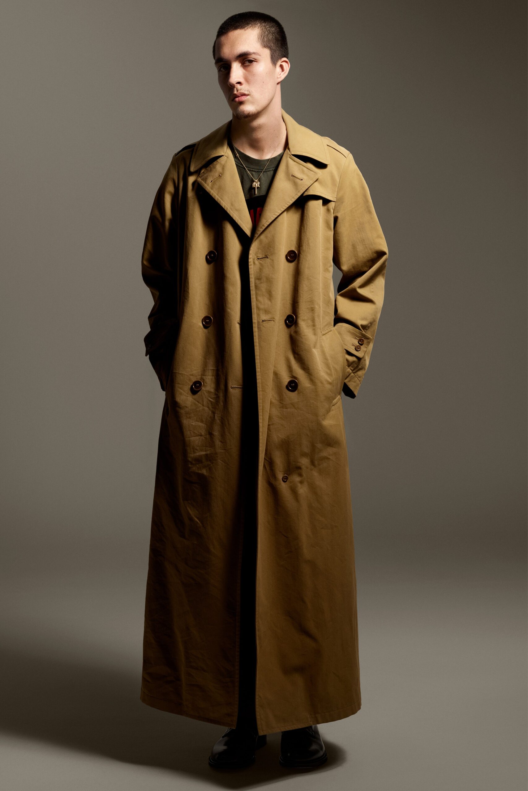 brown cotton trench coat and black t-shirt