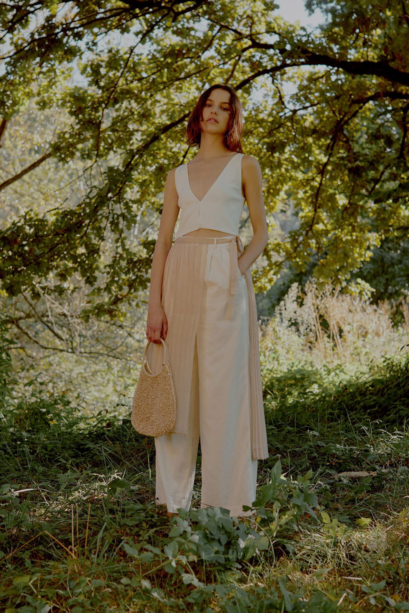 white fitted top and beige relaxed pants
