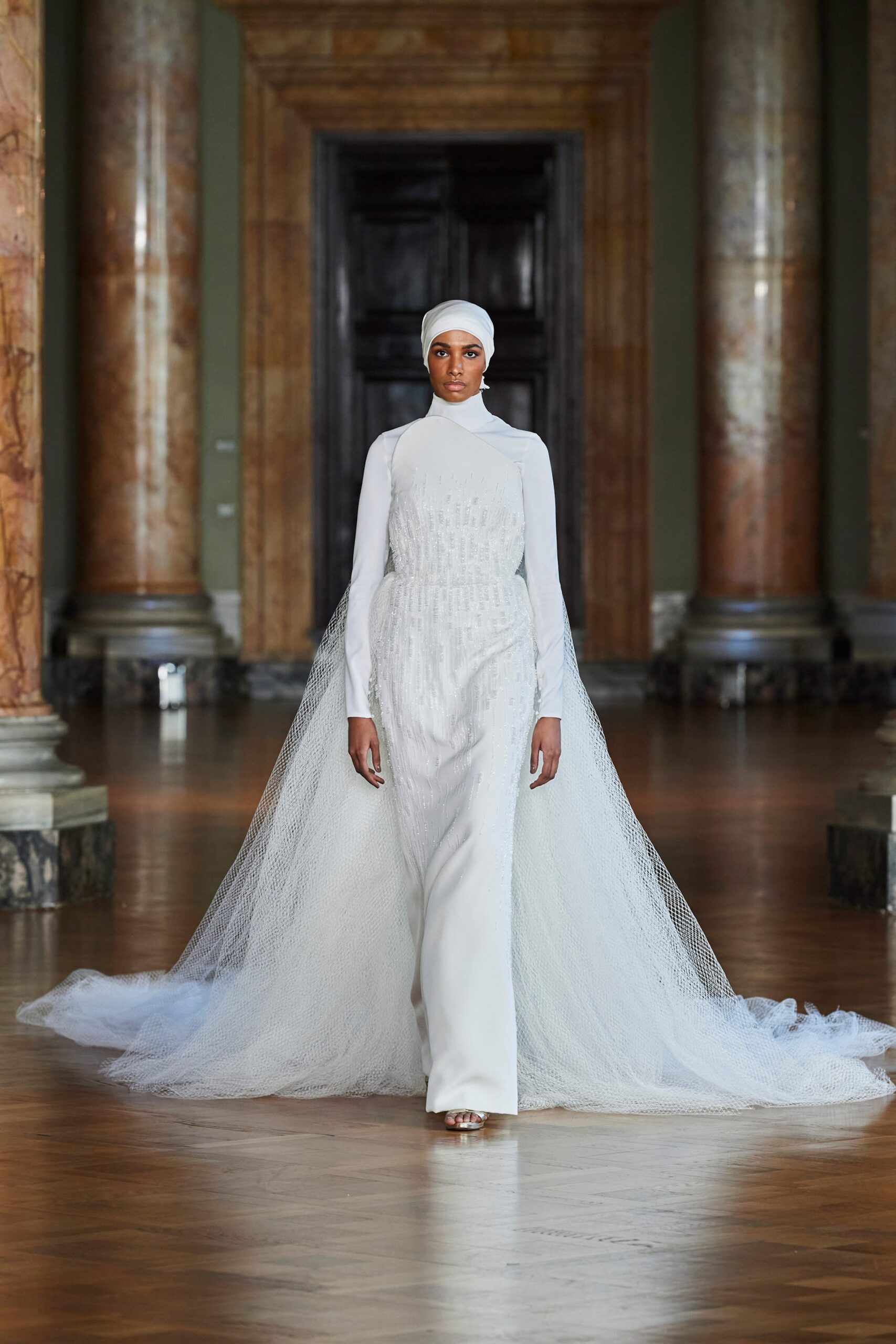 white silk gown with tulle cape