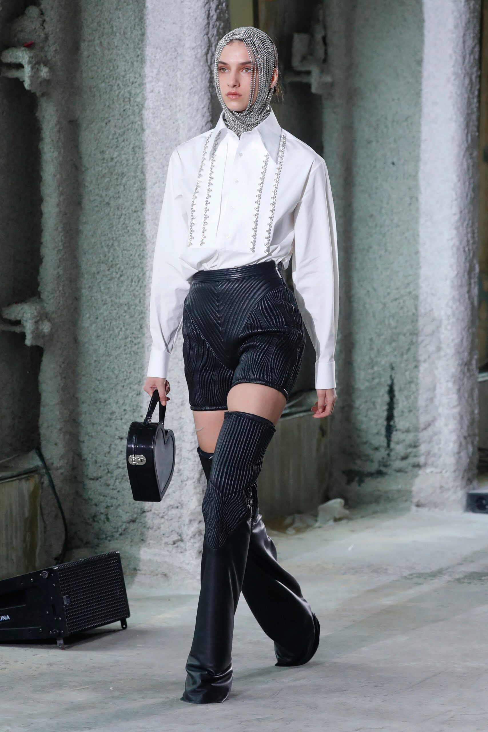 white fitted shirt with black shorts