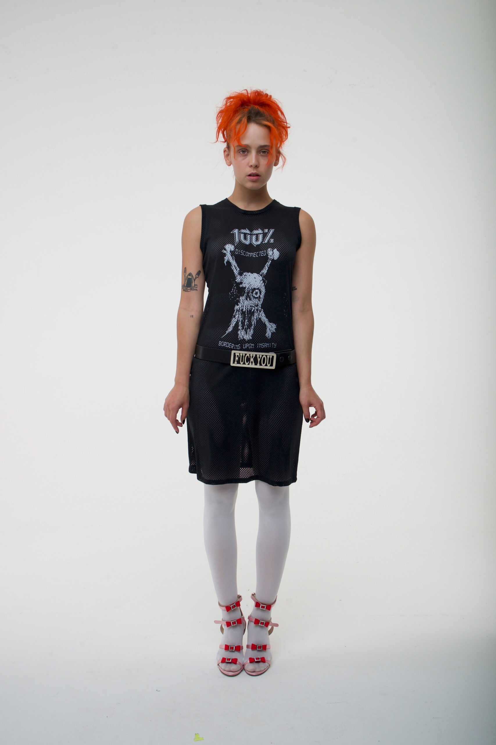 black mesh sleeveless dress with strappy shoes