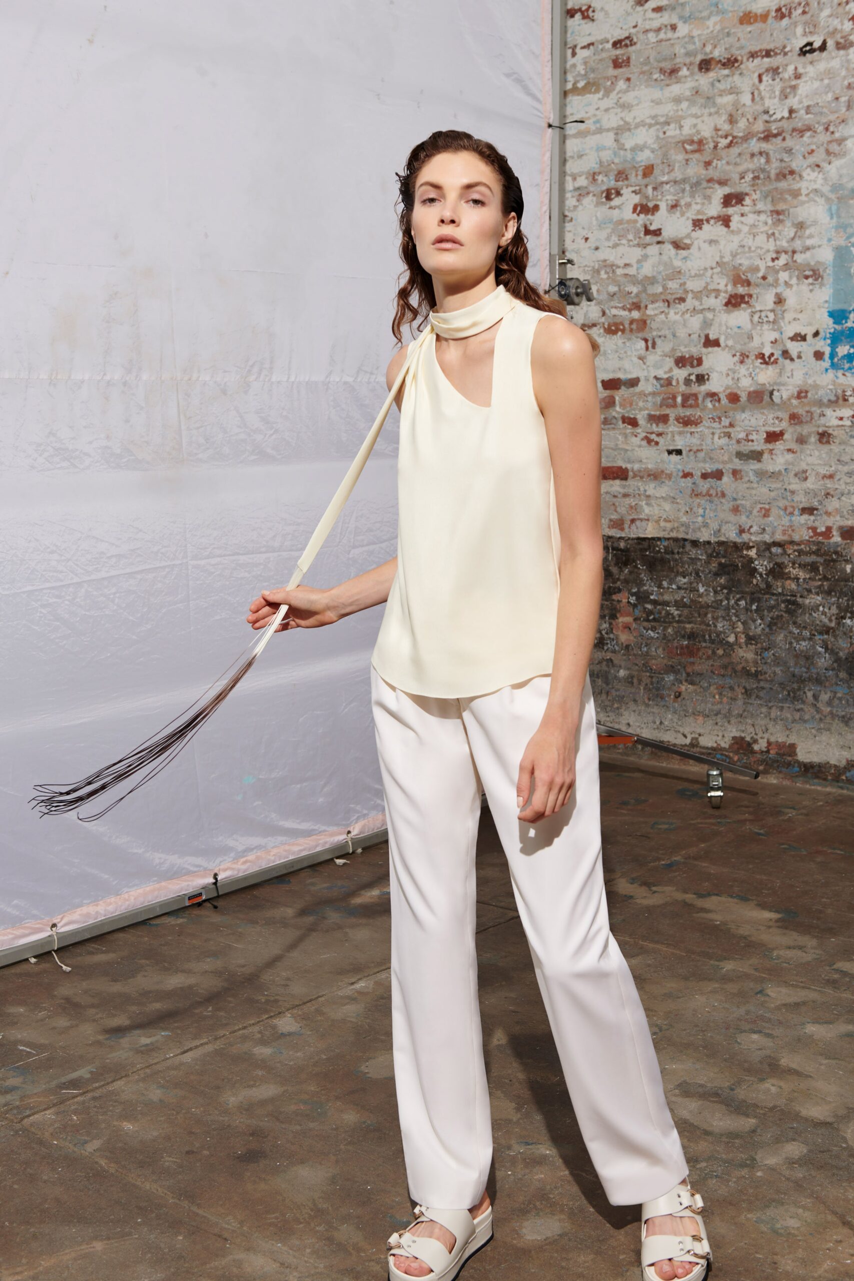 ivory silk sleeveless high-neck fitted top