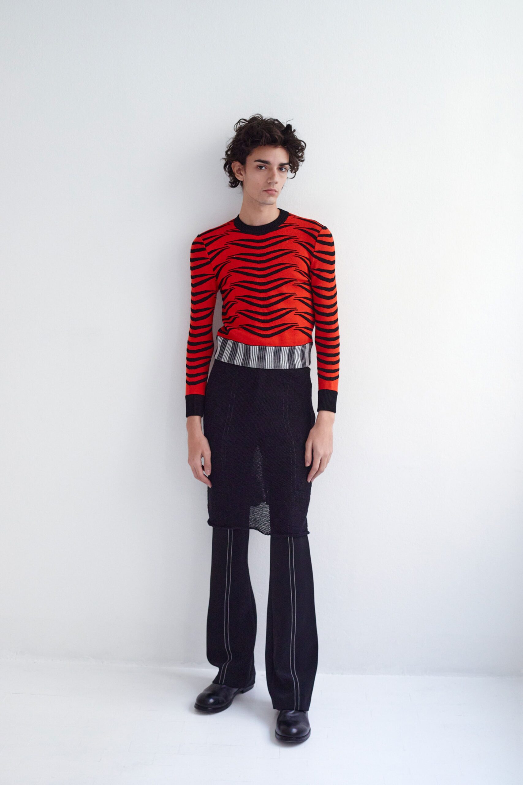 red striped fitted top with black pants