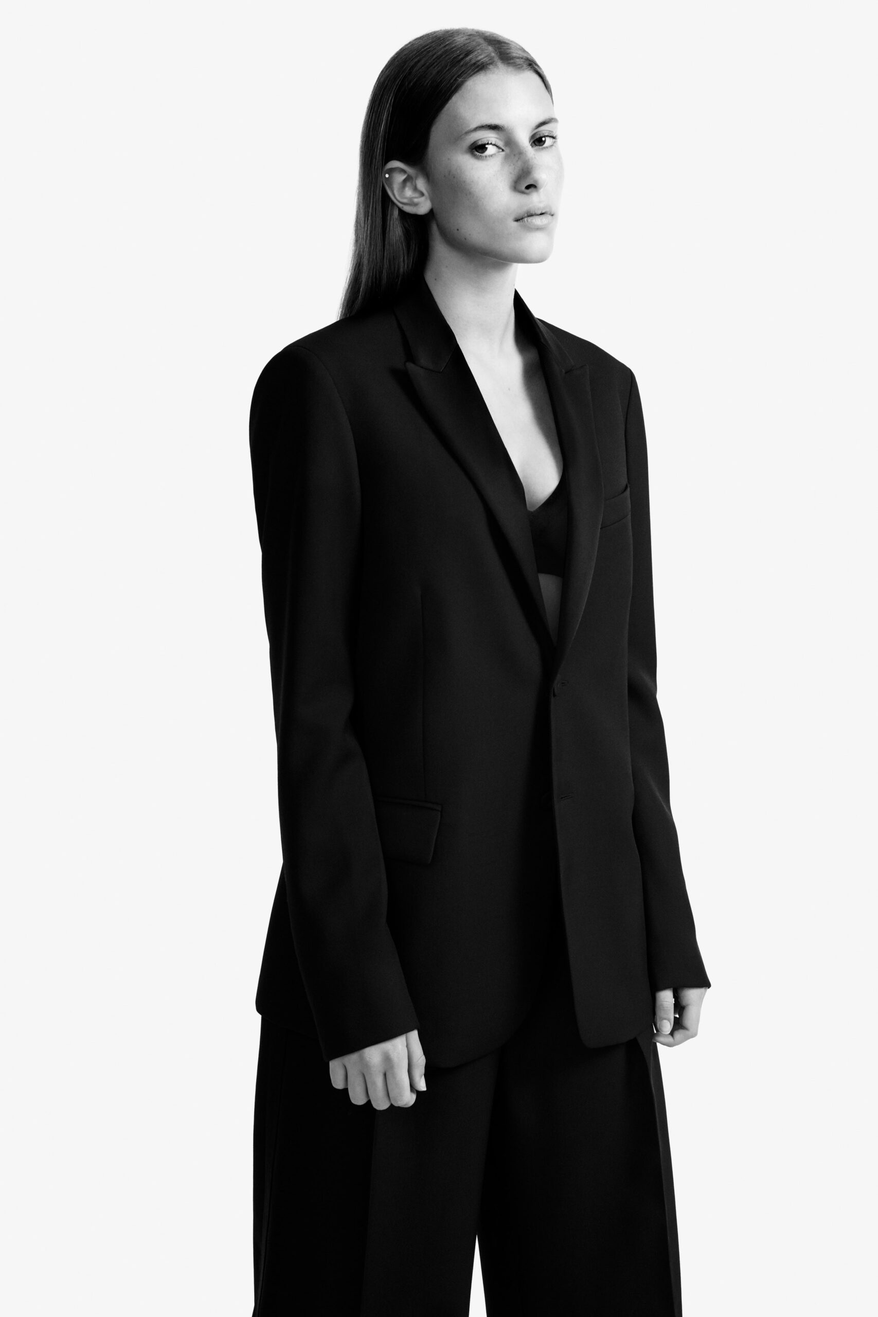black tailored blazer and relaxed pants