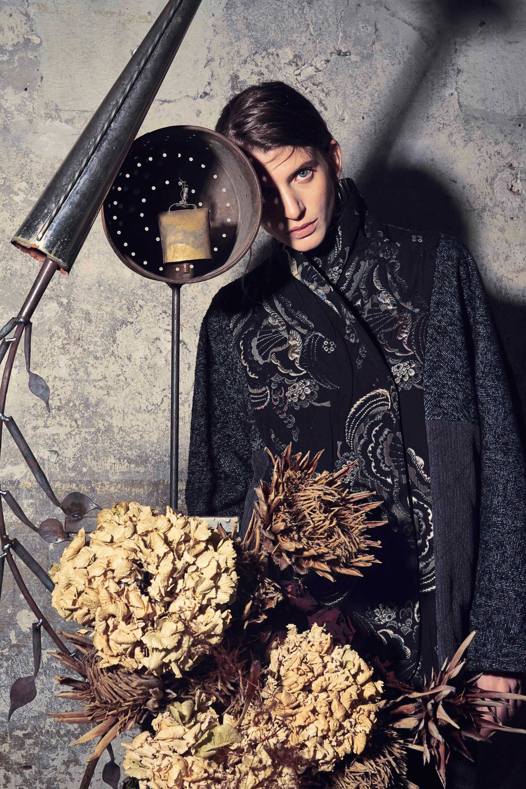 black wool coat with embroidered detail
