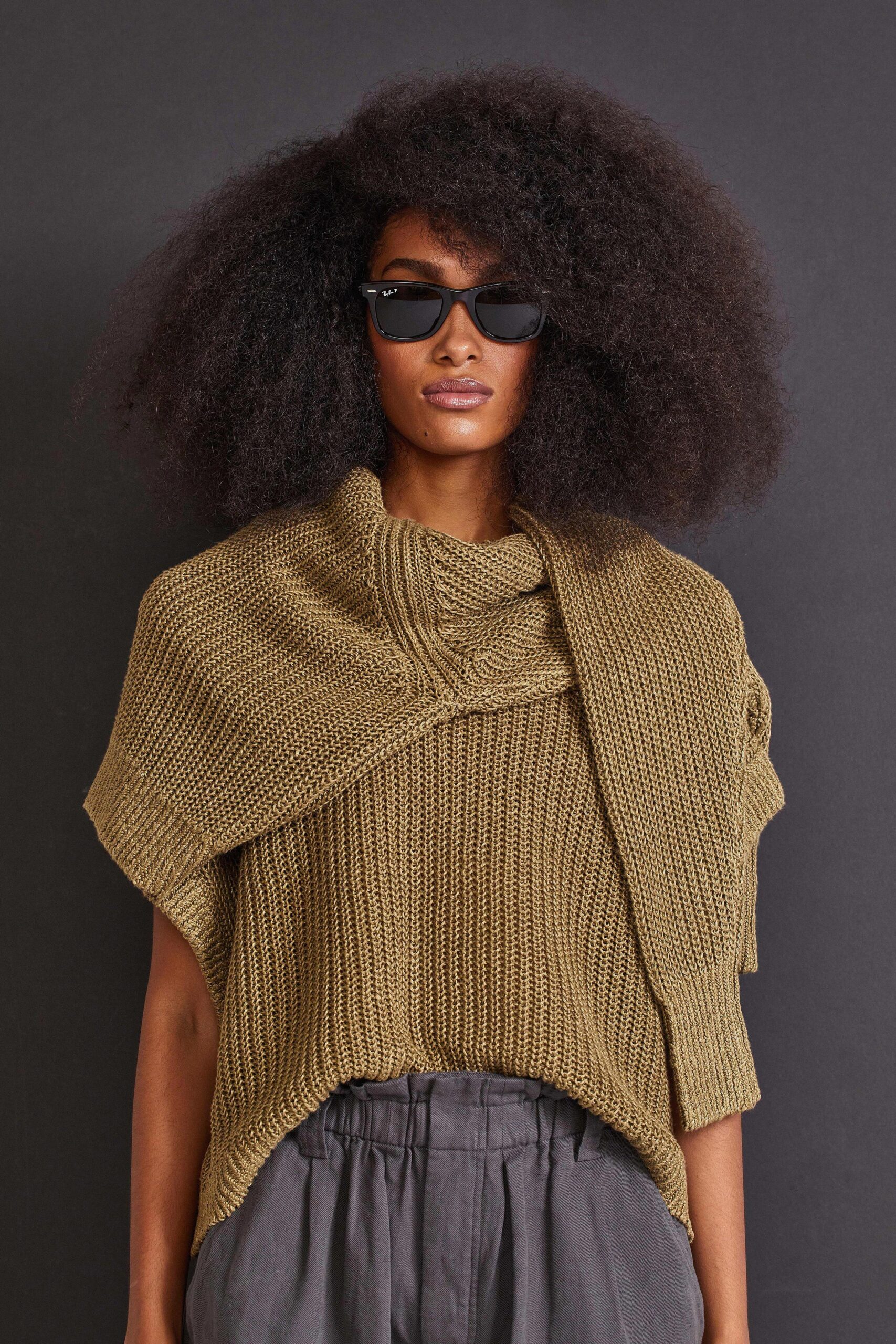 brown knit top with gray pants