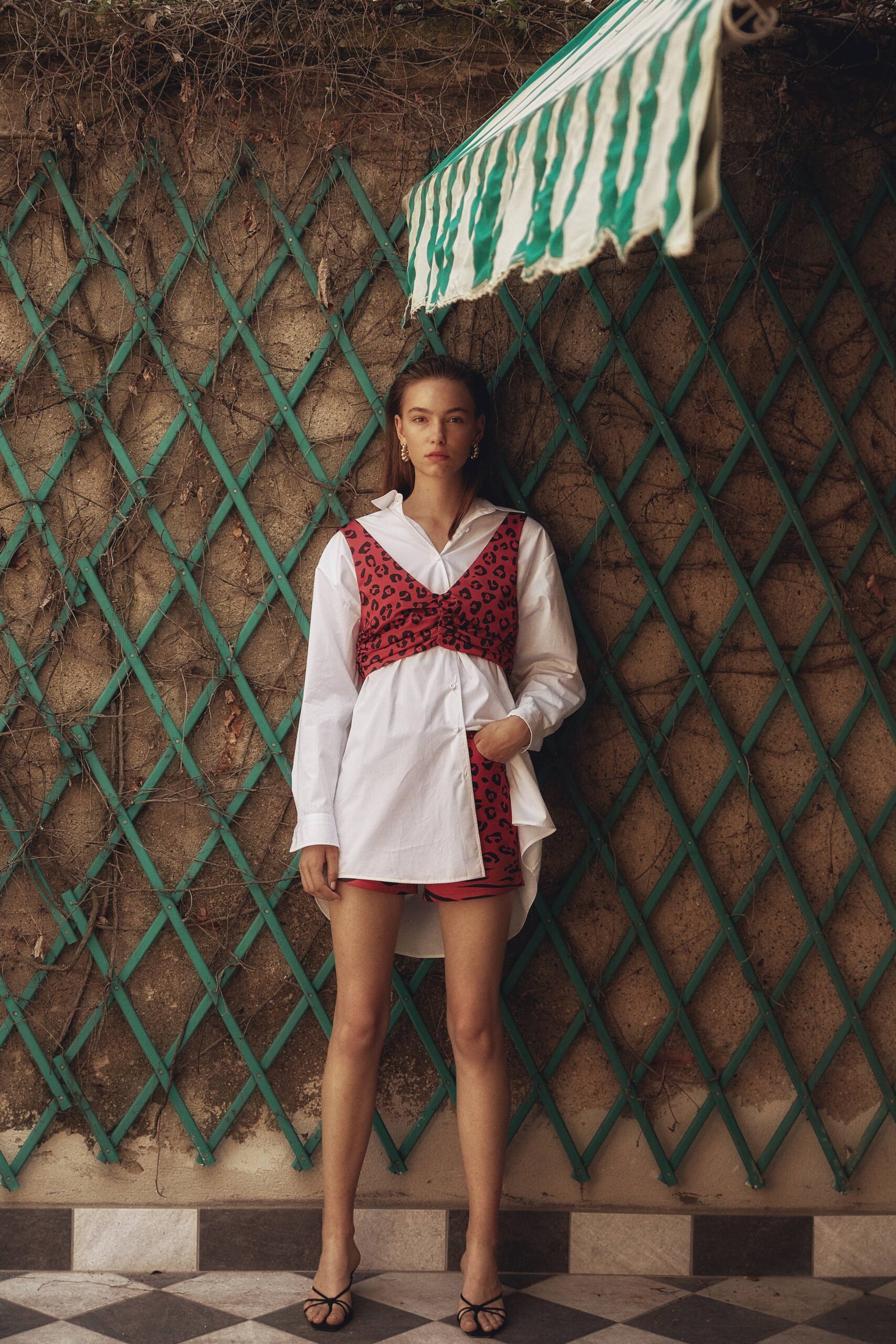 red cotton sleeveless v-neck fitted animal-print mini dress
