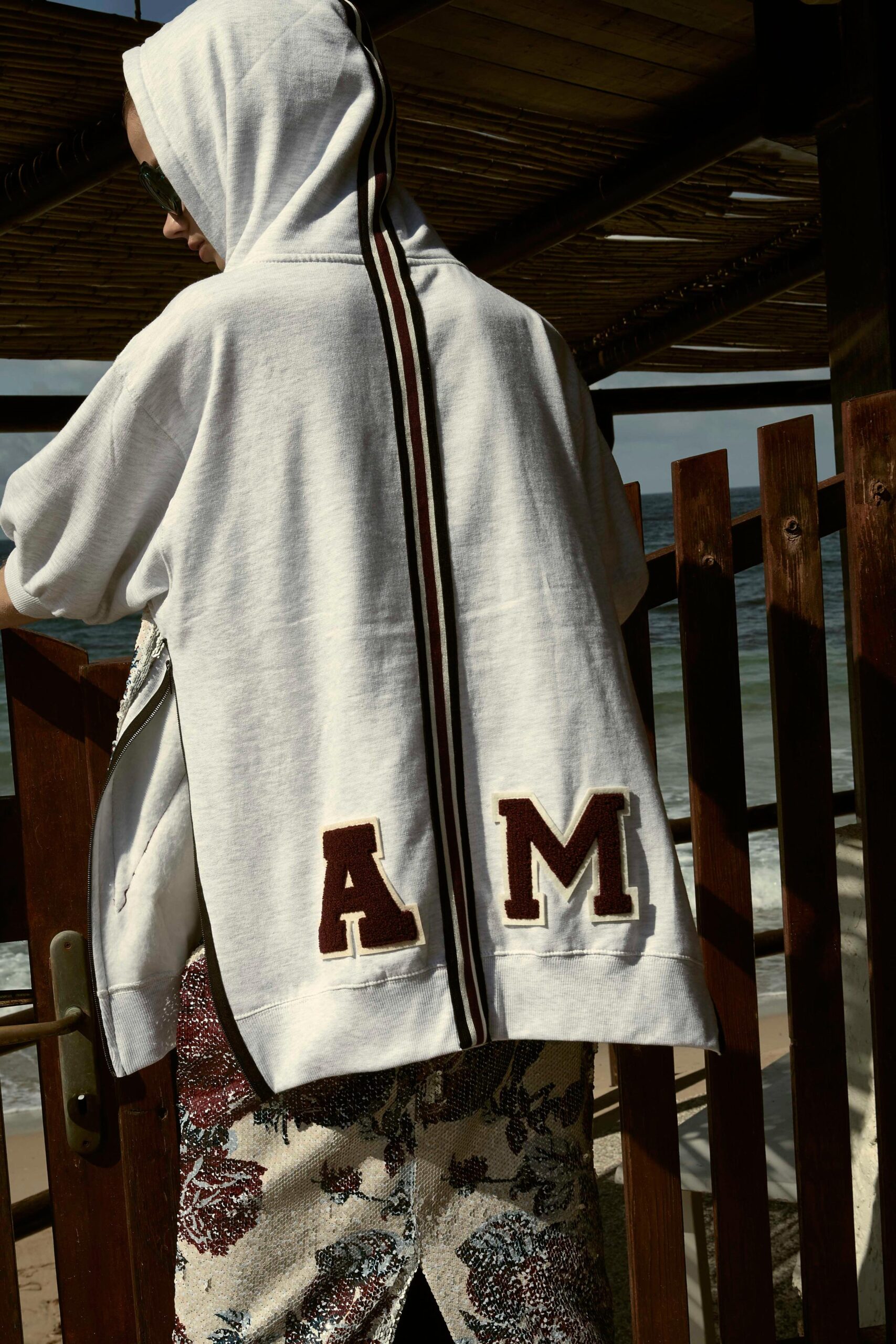 white relaxed hoodie with flared pants
