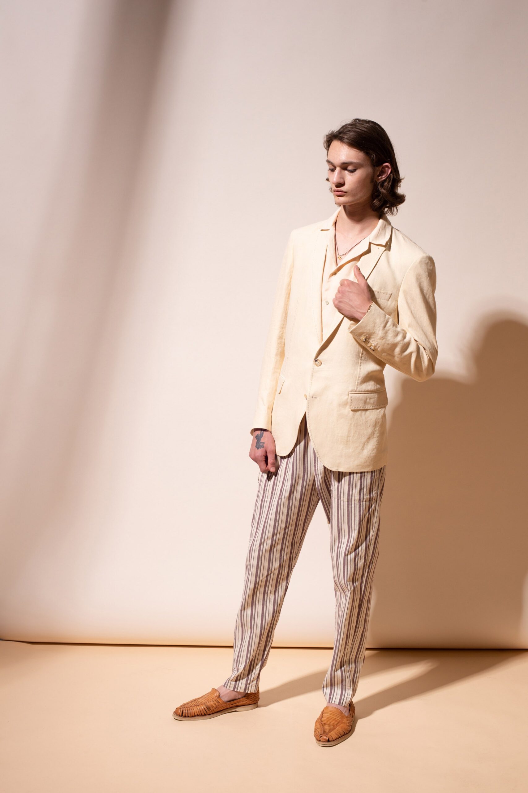 beige linen blazer with striped pants