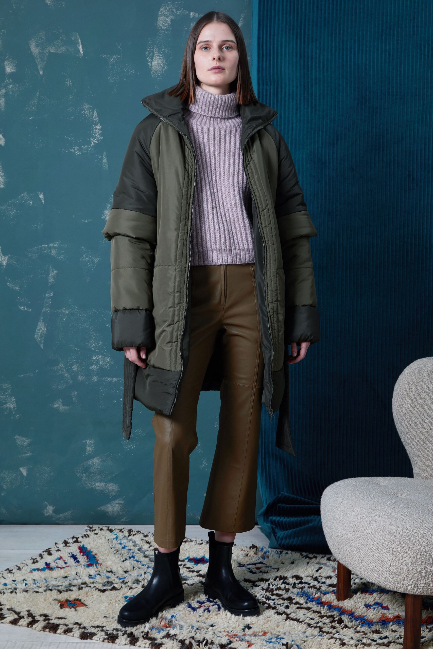 green coat pink sweater brown pants