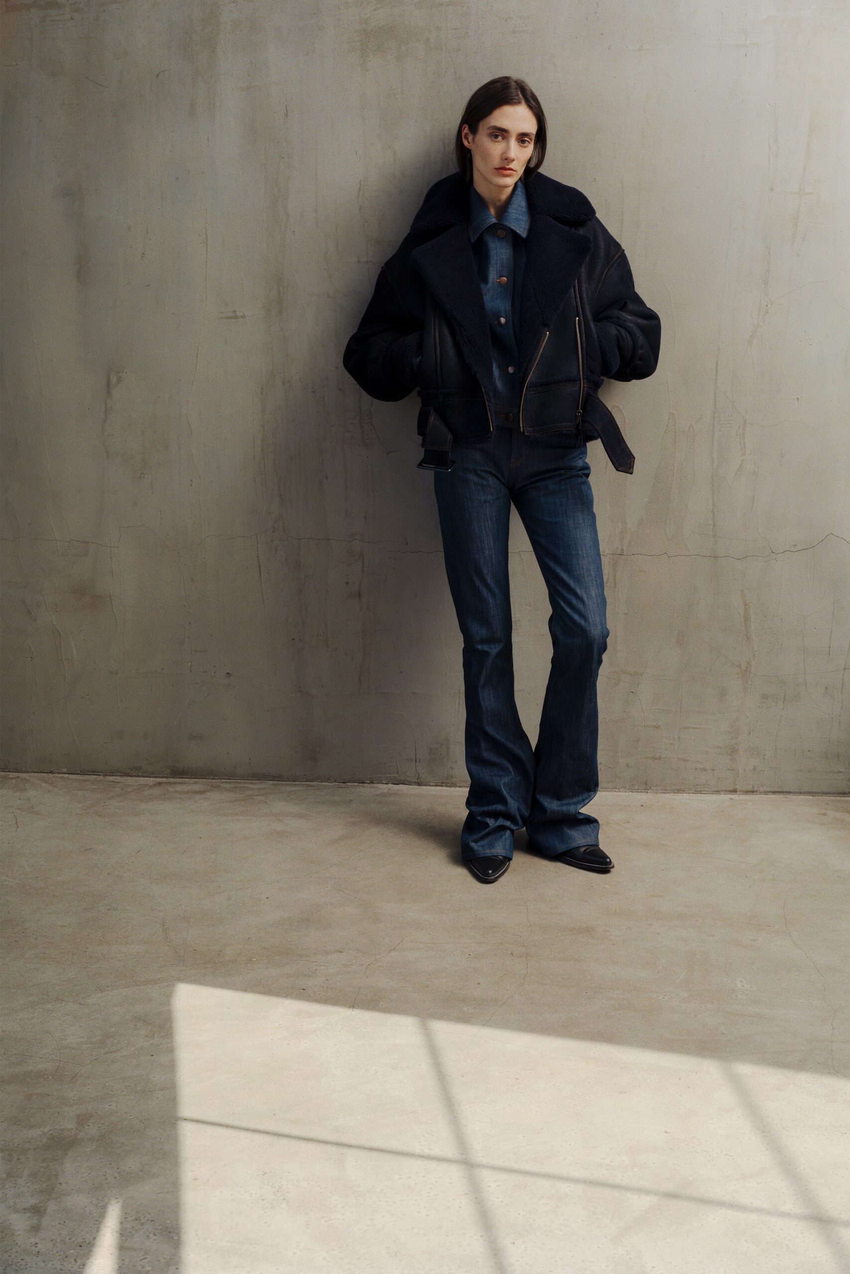 black fitted jacket with blue shirt