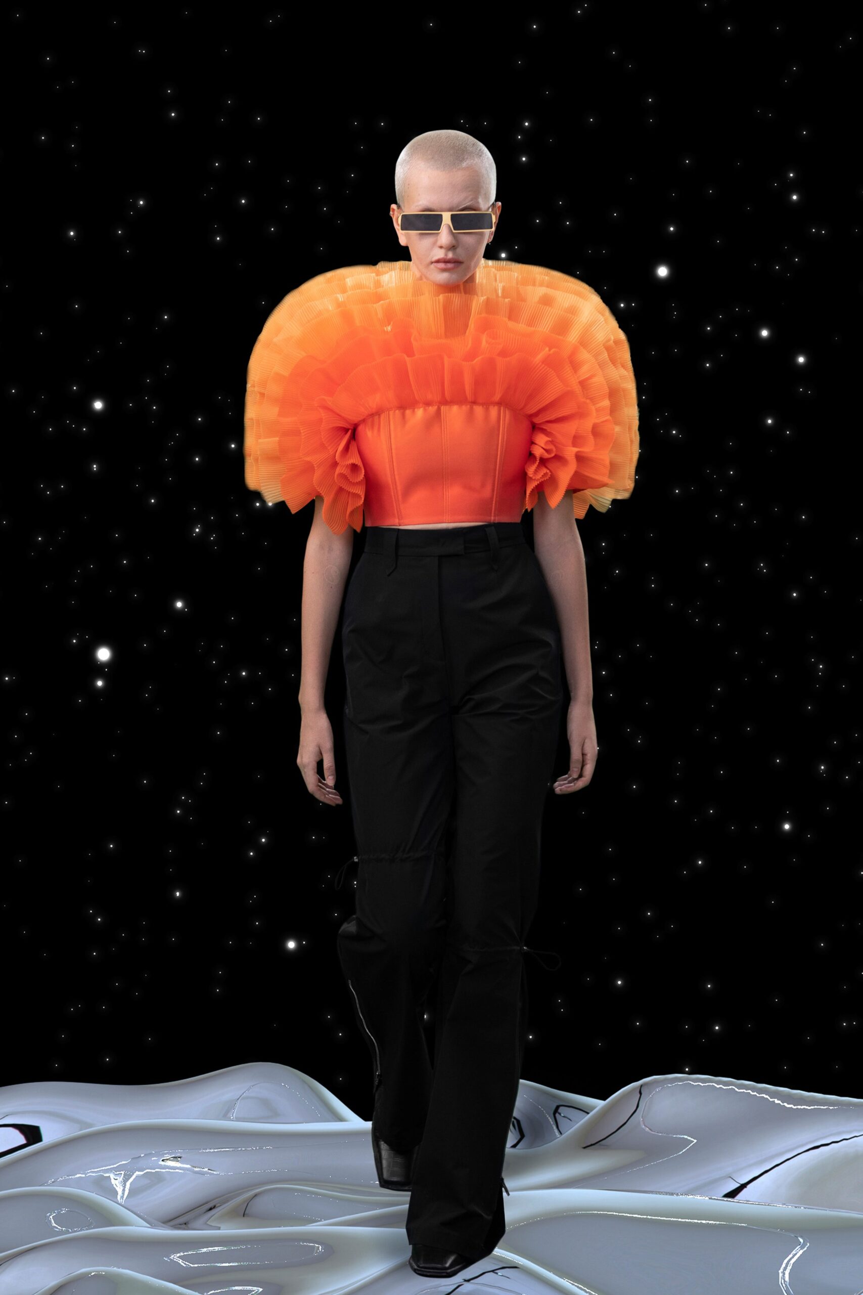 orange ruffled top with tailored pants