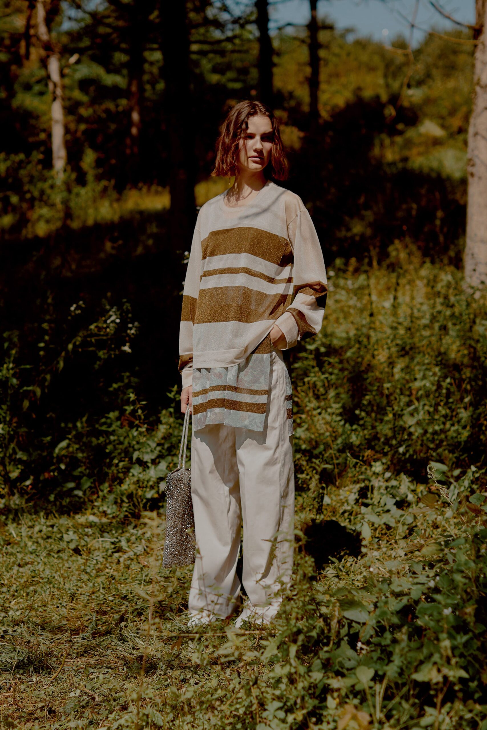 beige striped relaxed top with white pants