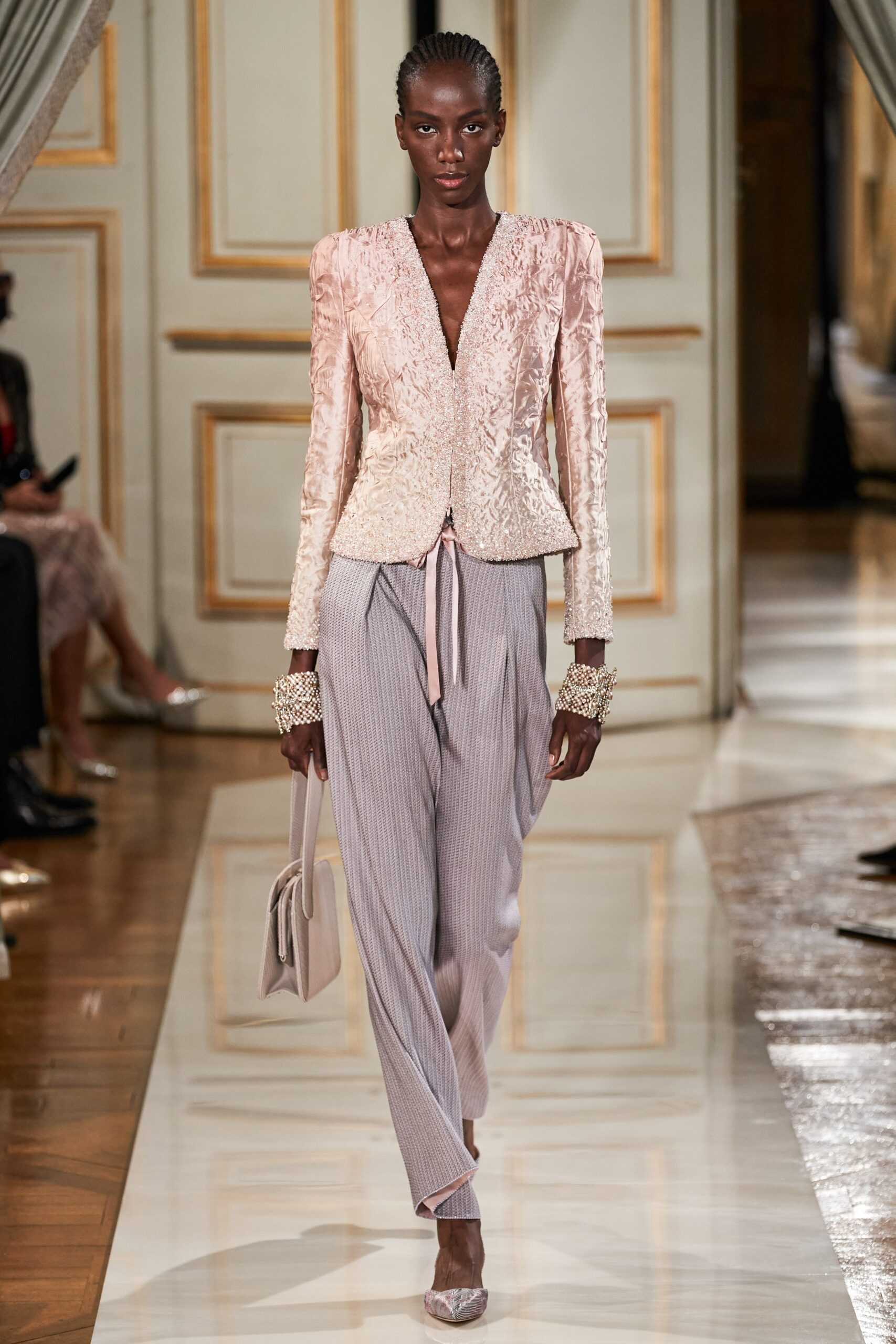 pink embroidered blazer with gray pants