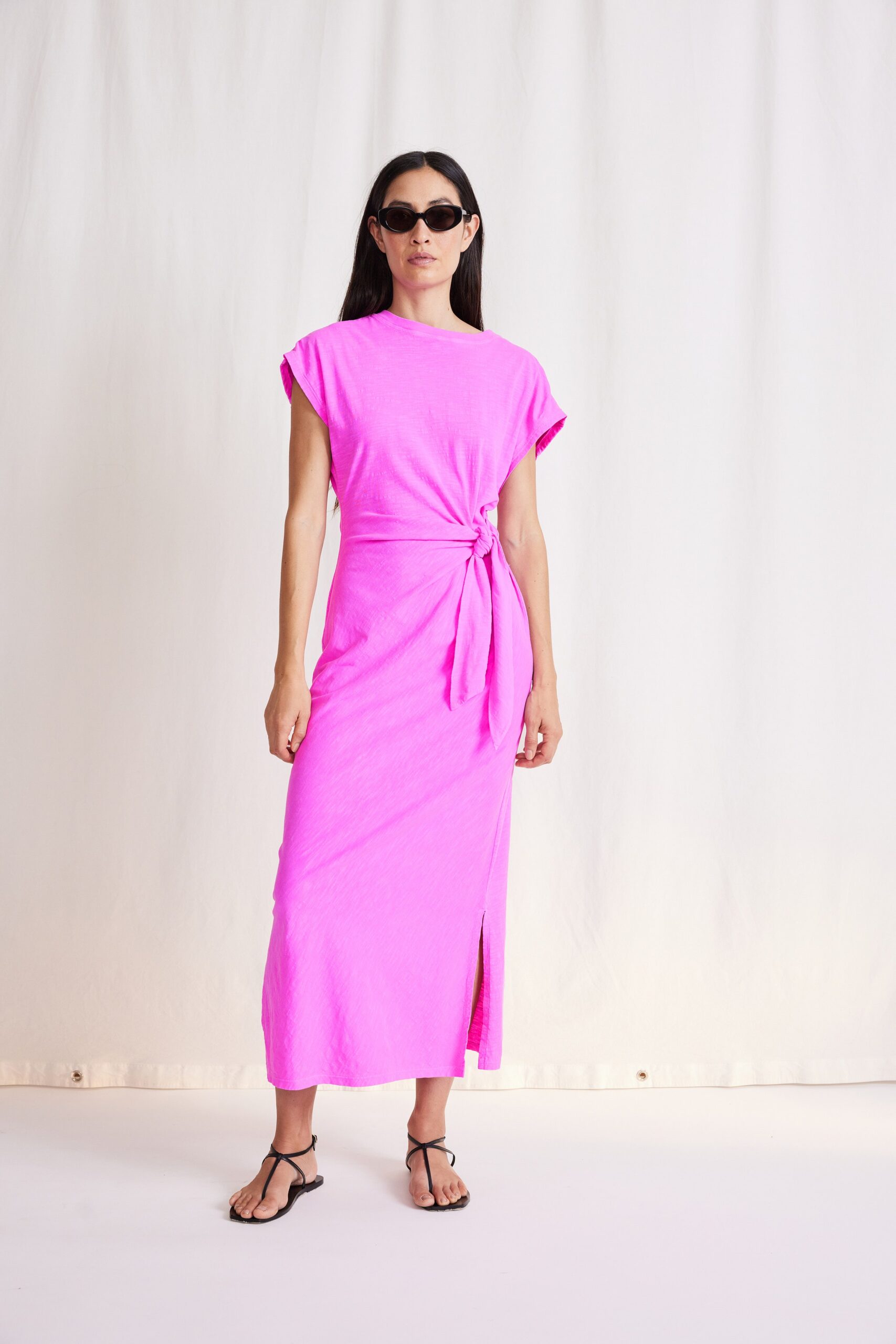 pink cotton sleeveless high-neck fitted tiered belted dress