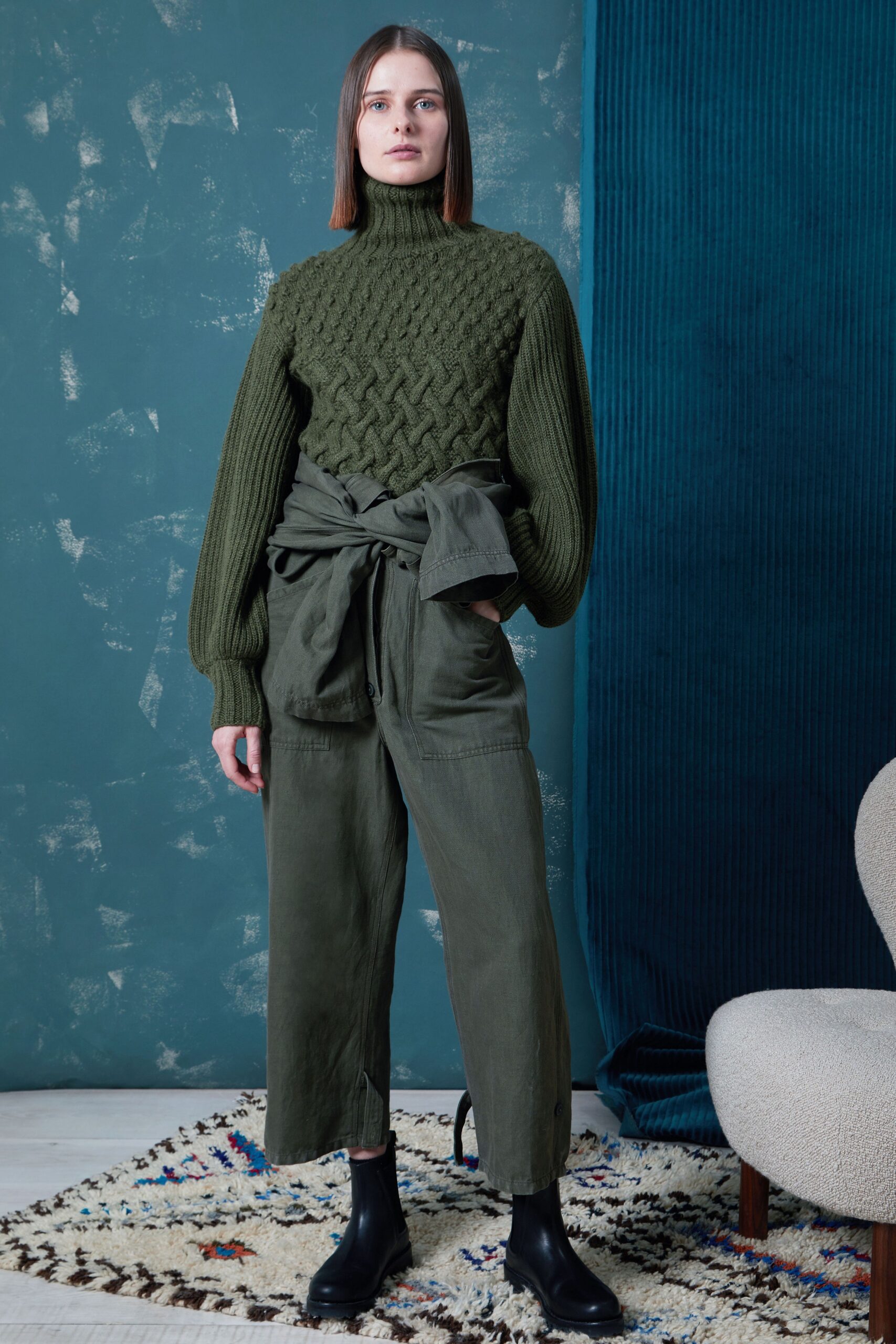 green wool sweater with olive pants