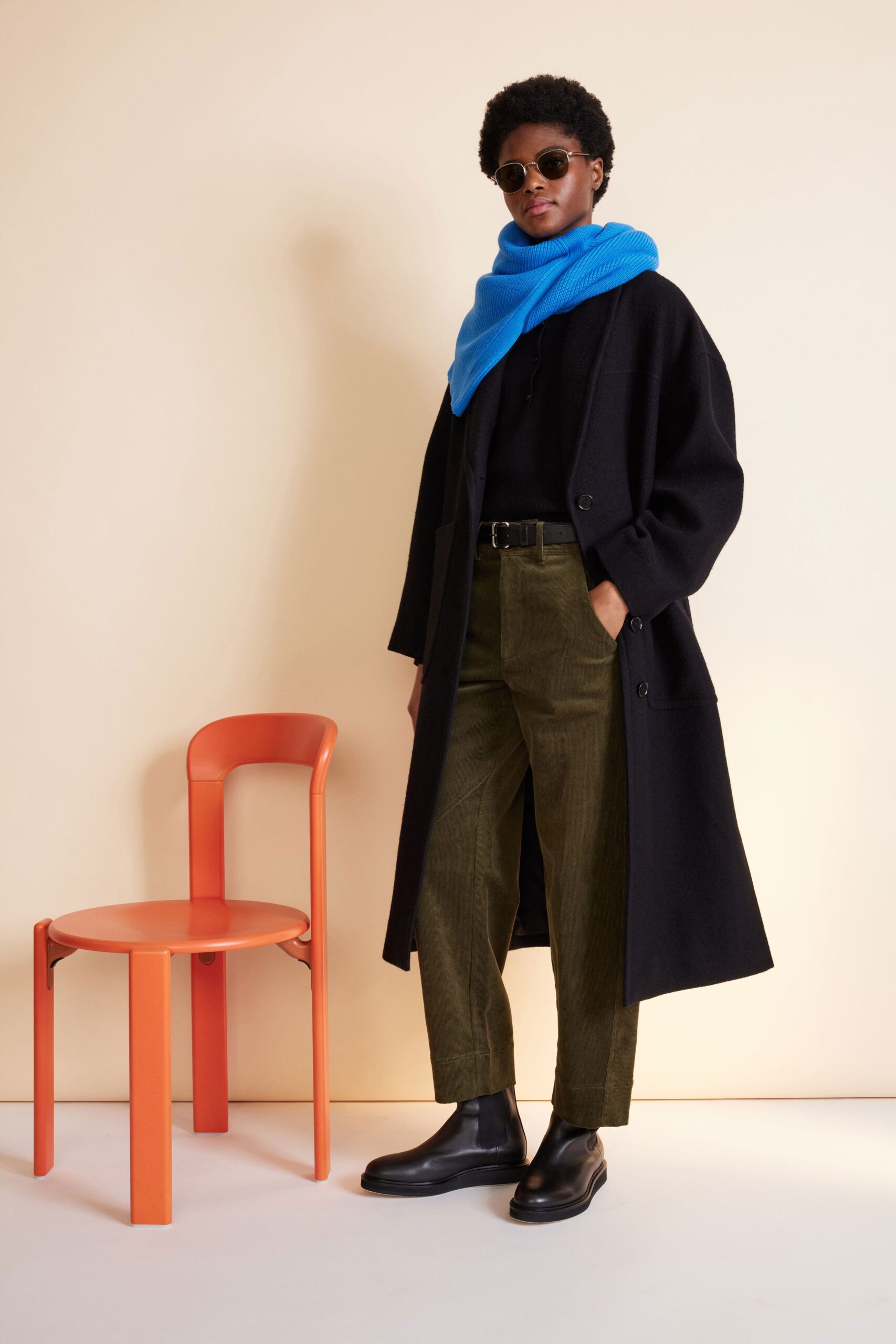 black wool coat with blue sweater