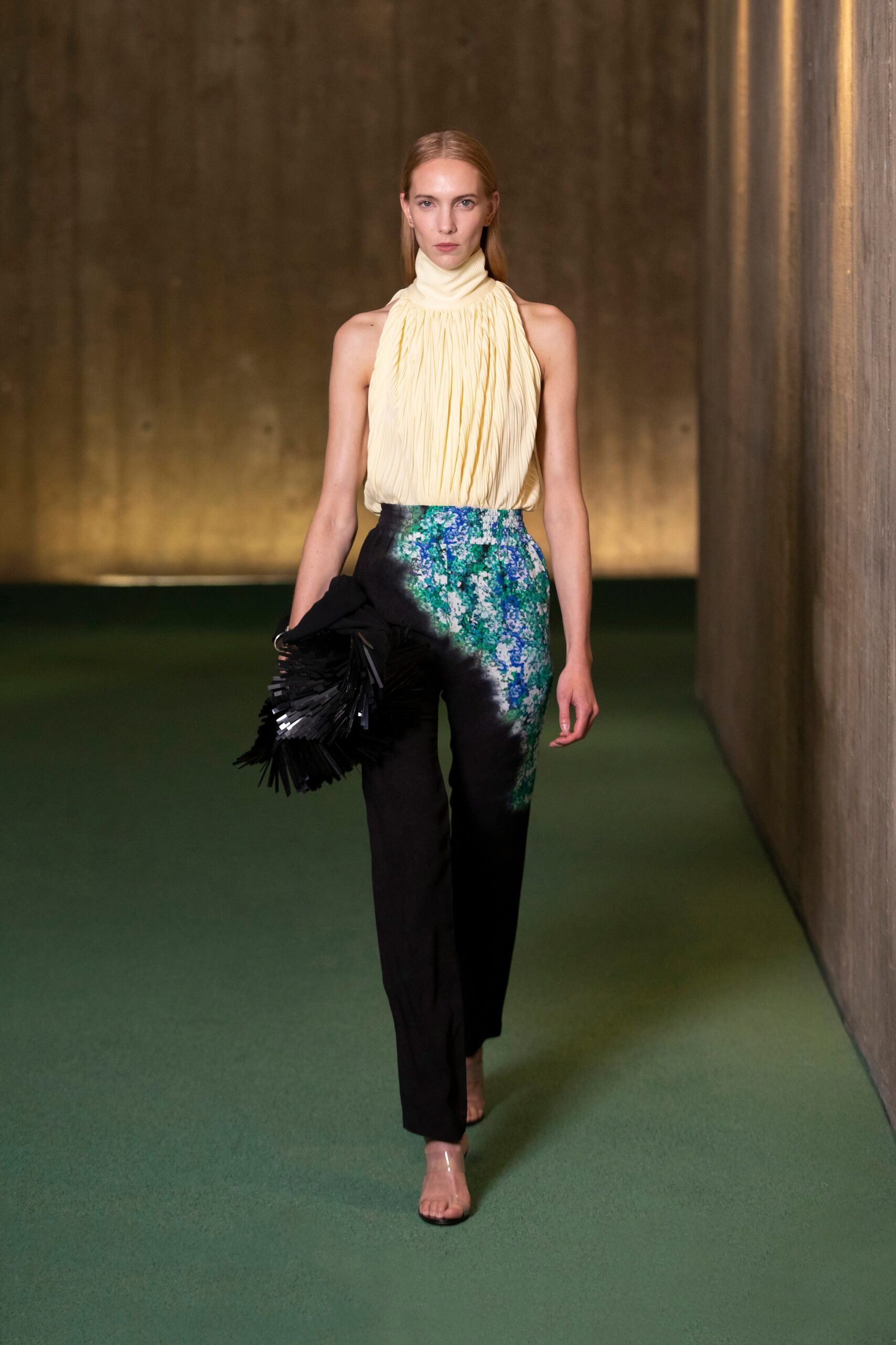 yellow pleated top with black pants
