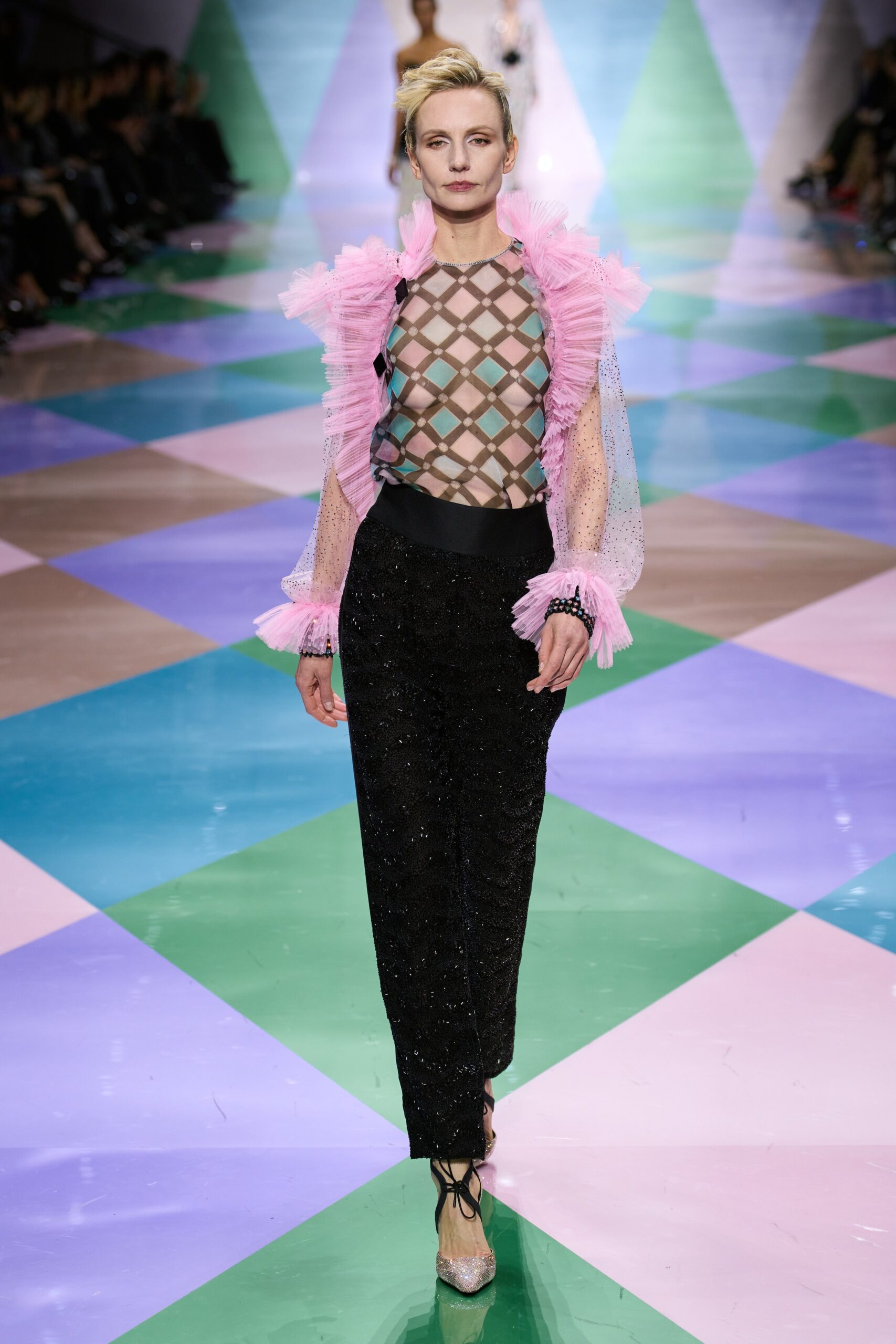black sequined pants with pink ruffled top