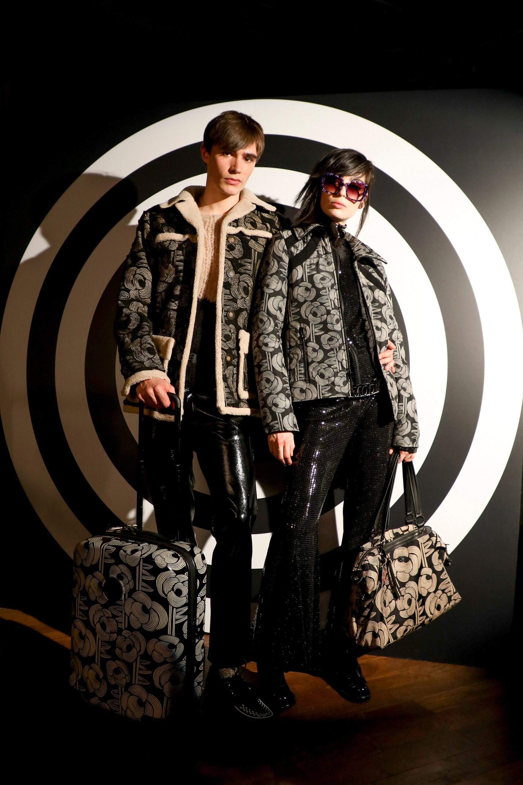 black and white printed jacket and flared pants