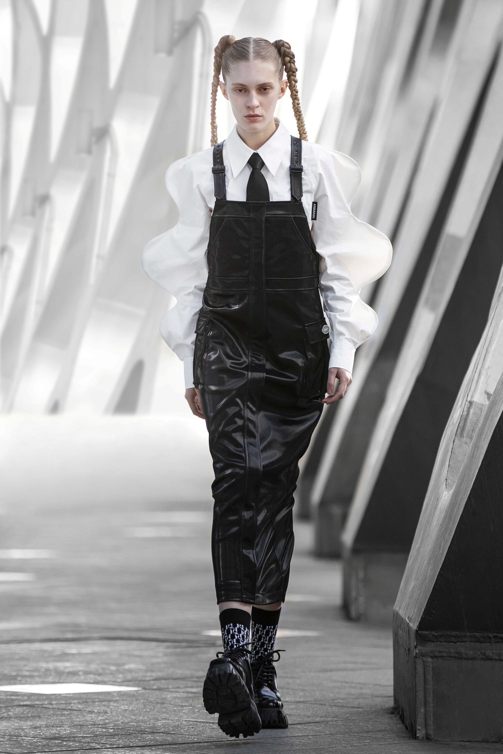 black vinyl jumpsuit with white shirt