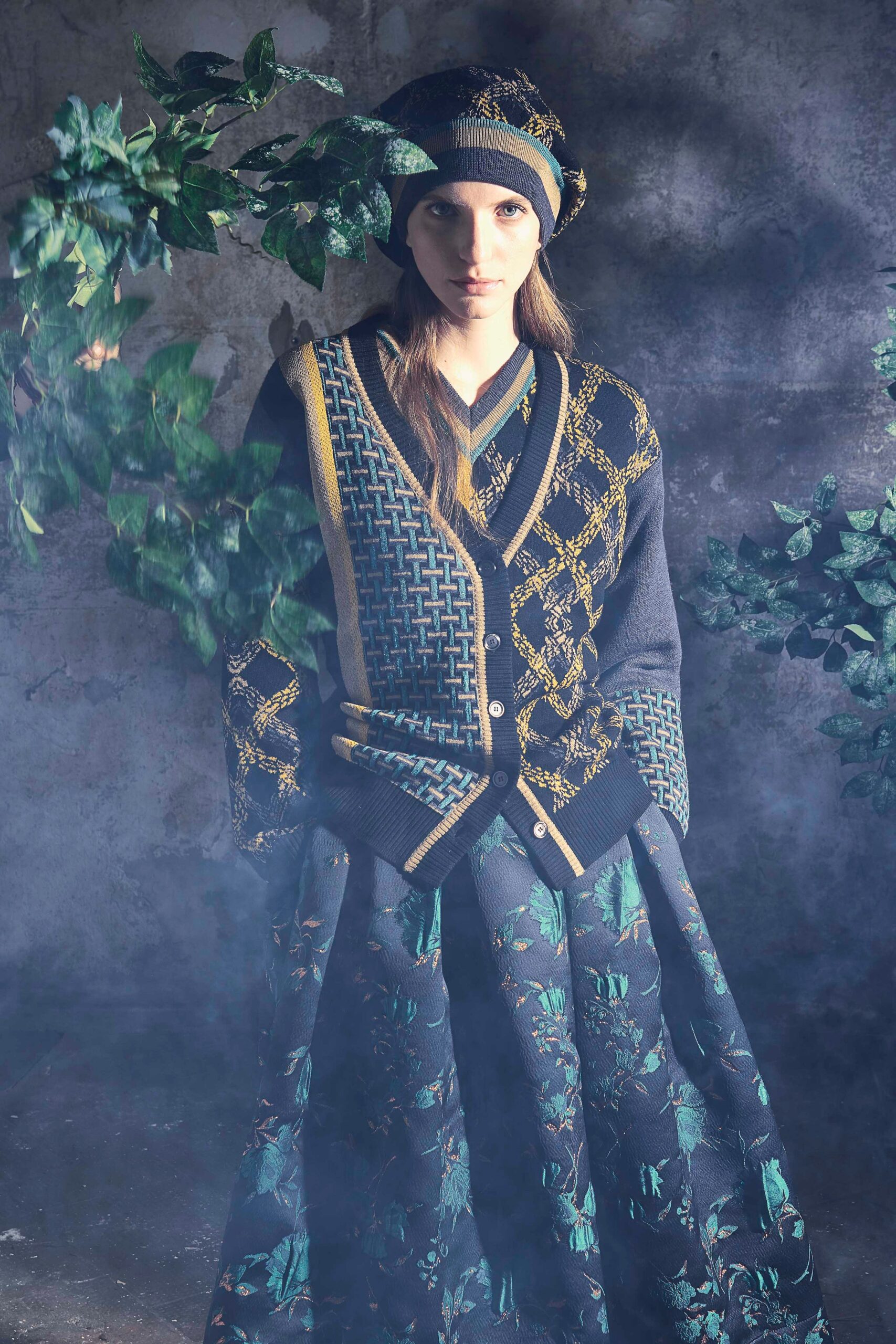 embroidered black cardigan and green skirt