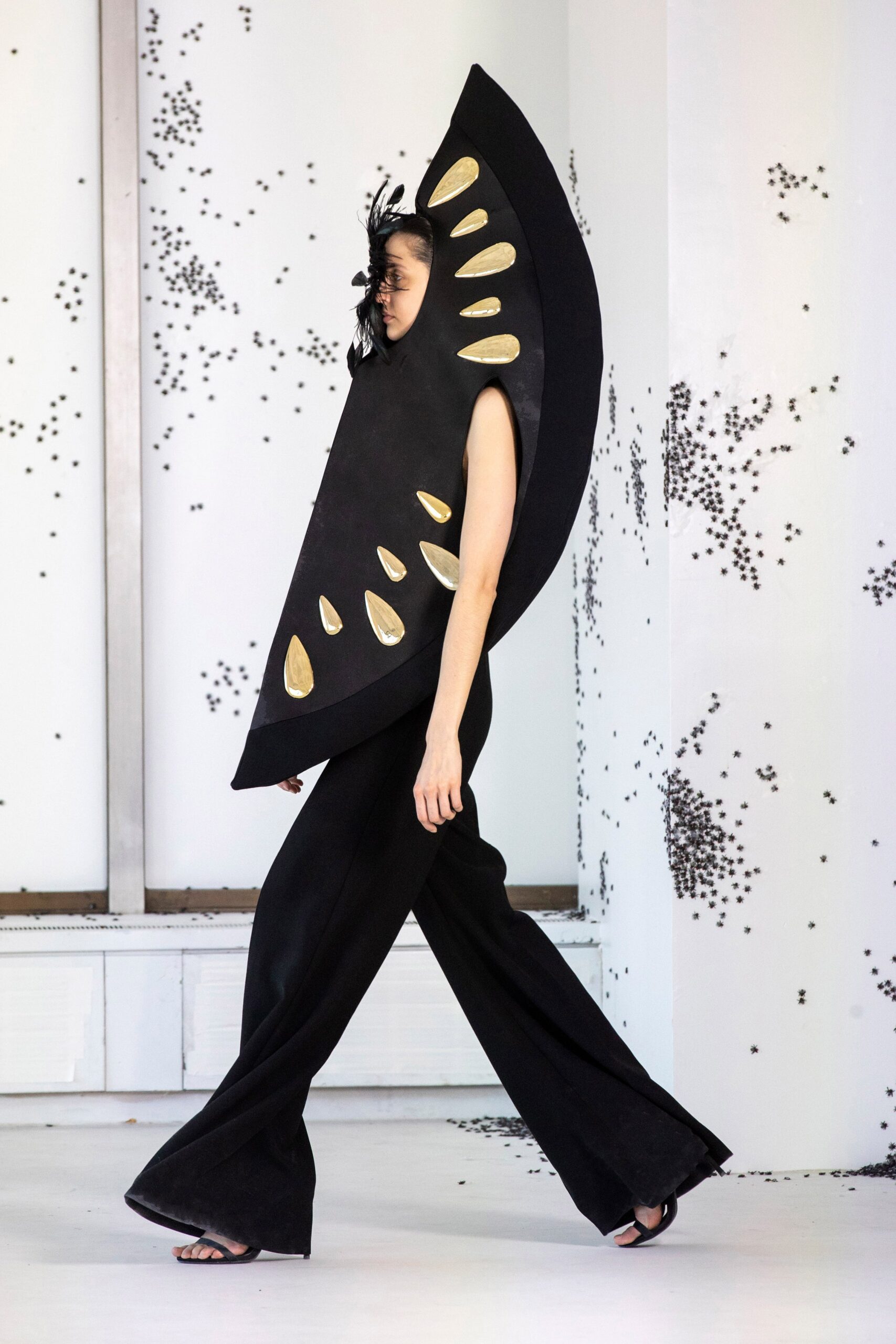 black fitted jumpsuit with cape