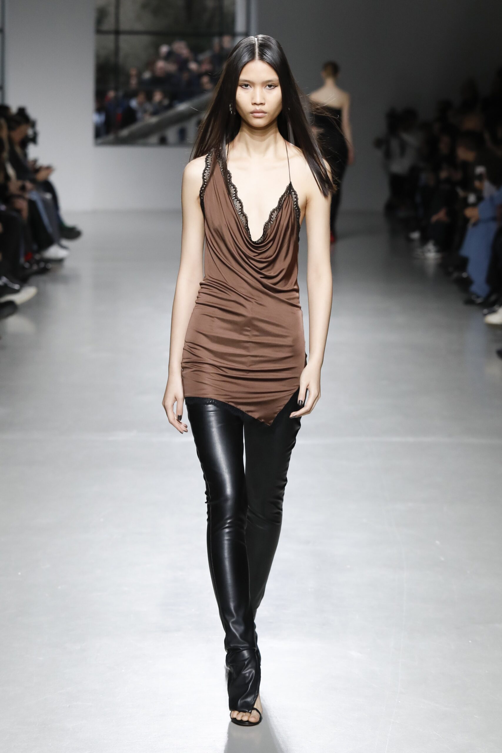 brown silk fitted top with black leather pants
