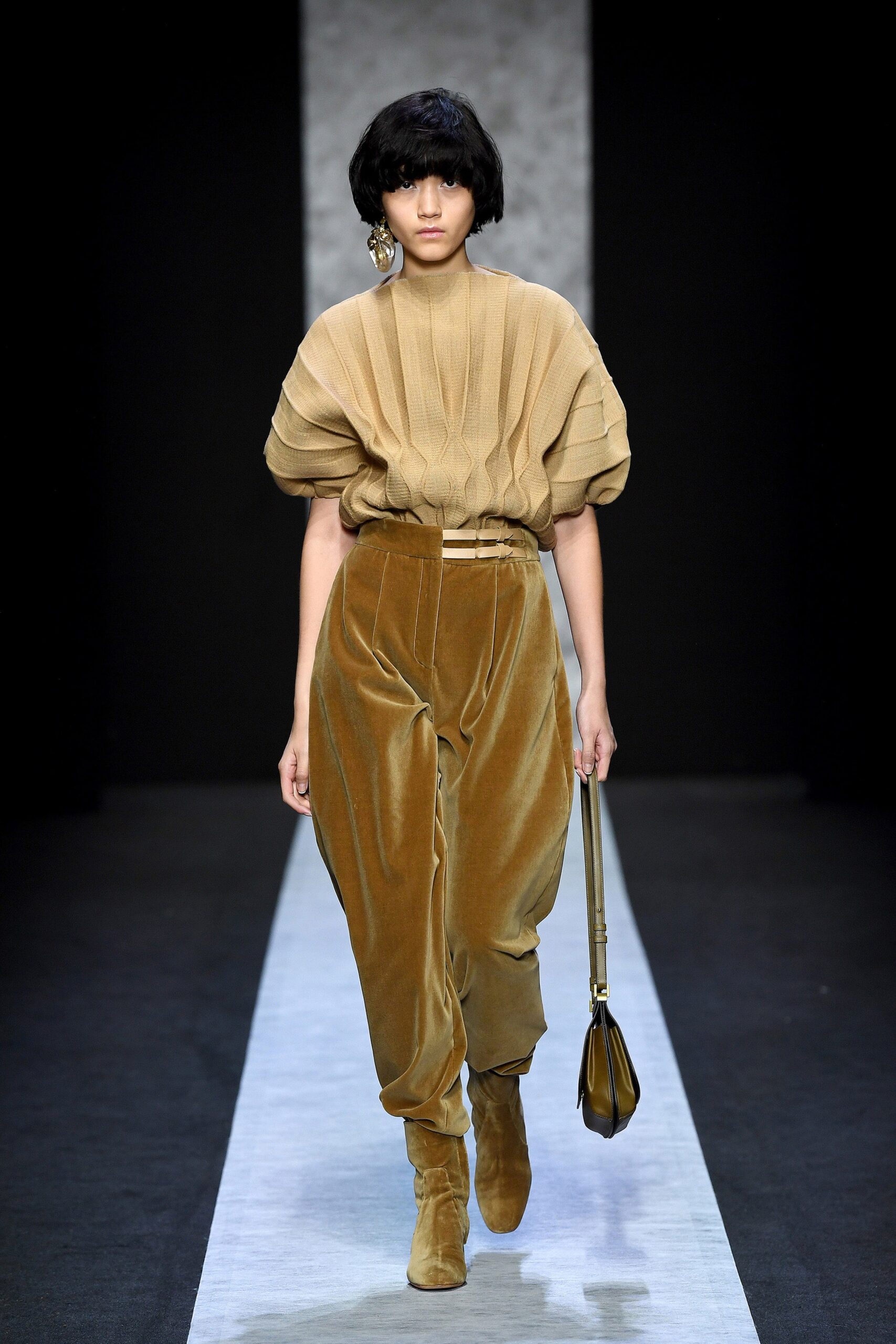 beige pleated top with brown pants