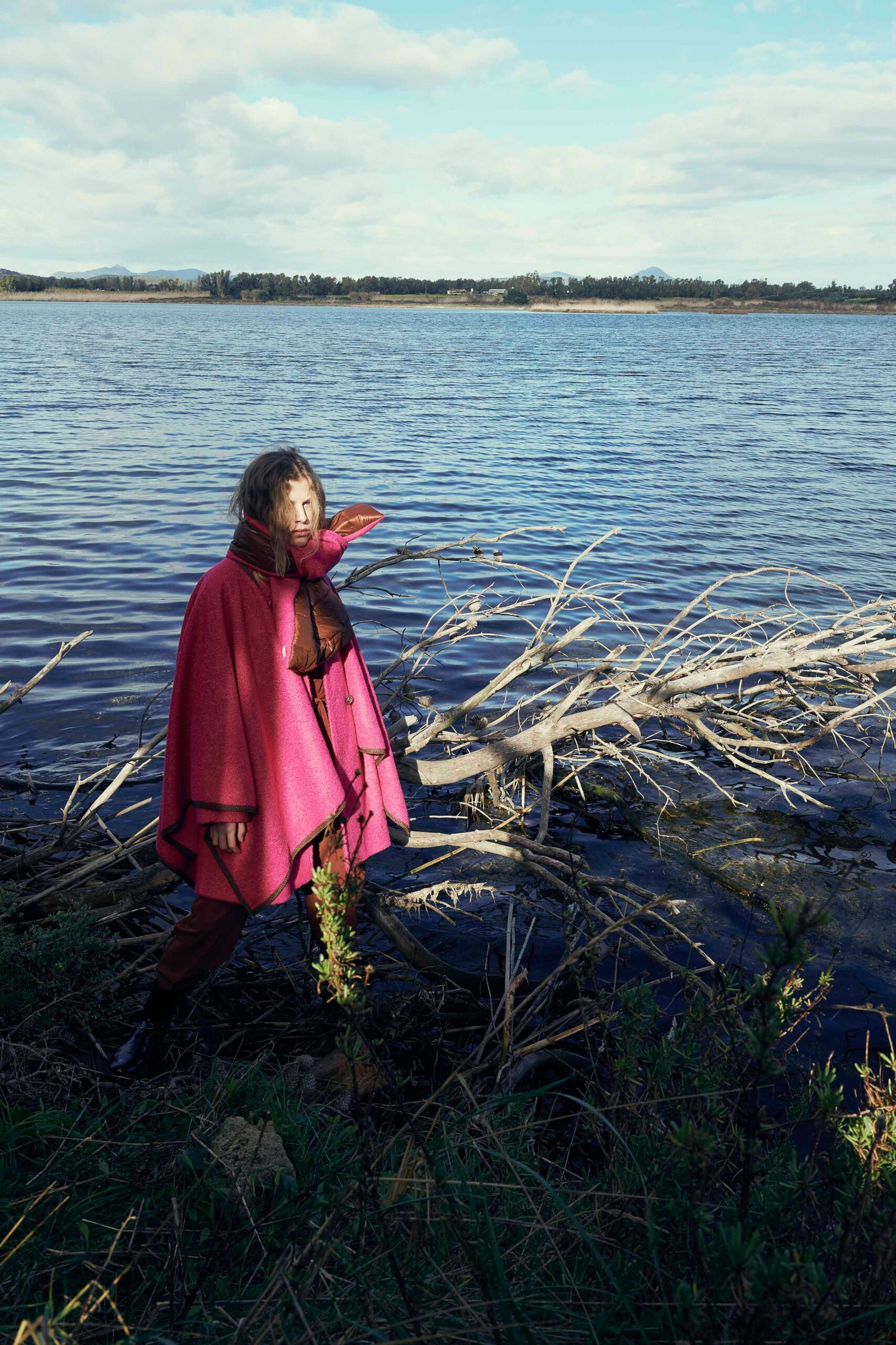 pink wool poncho with brown pants